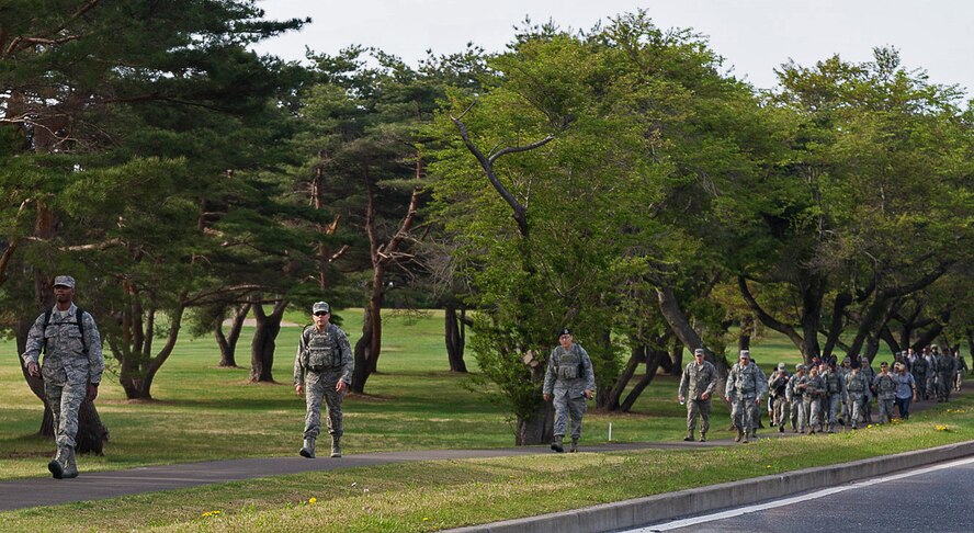 More than 30 Airmen assigned to the 35th Security Forces Squadron take part in a ruck march at Misawa Air Base, Japan, May 12, 2014. Airmen marched a total of eight miles in commemoration of National Police Week. (U.S. Air Force photo/Staff Sgt. Jared Elliott)