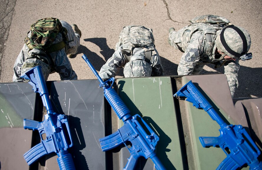 A team pushes a High Mobility Multipurpose Wheeled Vehicle (HMMWV), commonly known as a Humvee, during the 52nd Security Forces Squadron National Police Week decathlon at Spangdahlem Air Base, Germany, May 14, 2014. The decathlon, one of several events hosted by the 52nd SFS throughout the week, featured teams of four competing against each other in 10 events. The winning team was from the 52nd SFS police services section. (U.S. Air Force photo by Staff Sgt. Chad Warren/Released)
