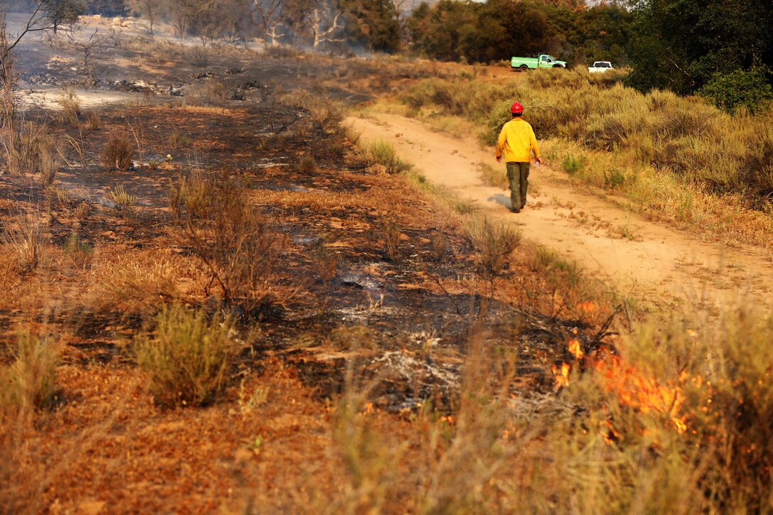 Marines and fire crews respond to wildfires ablaze in Southern California May 15, 2014. 
