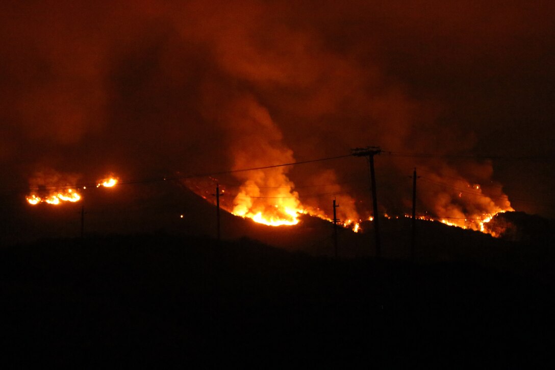 The School of Infantry-West (52 Area) evacuation order has been lifted. All personnel can return via the I-5 and Basilone Rd. gate to the 52 Area.

The San Mateo Fire (Combat Fire) that was reported at 11:24 a.m. Friday has burned 1,000 acres and is currently listed as 25% contained. The Las Pulgas fire first reported at 3:15 p.m. Thursday has burned 15,000 acres and is listed at 40% containment.  The Tomahawk fire that started Wednesday on Naval Weapons Station Fallbrook is currently listed at 6,500 acres burned and 75% containment.

Evacuation orders for Camp San Mateo (62 Area), Camp Las Pulgas (43 Area), Camp Las Flores (41 Area), Camp Margarita (33 Area), Marine Air Support Squadron 3 (32 Area) and Camp Vado Del Rio (25 Area) remain in effect.

Road Closures:

The Las Pulgas gate and Las Pulgas Road remain closed to all traffic except emergency vehicles.

The Christianitos Gate is closed to all traffic except emergency vehicles.

The San Mateo Road between Camp San Mateo and Camp San Onofre is closed.

The Naval Weapons Station Fallbrook gate and Ammunition Road remain closed.

Basilone Road from Marine Corps Air Station Camp Pendleton to Camp Horno remains closed.

Stuart Mesa Road north of Assault Craft Unit-5 to the Las Pulgas Gate remains closed.

The causes of the fires are under investigation.

