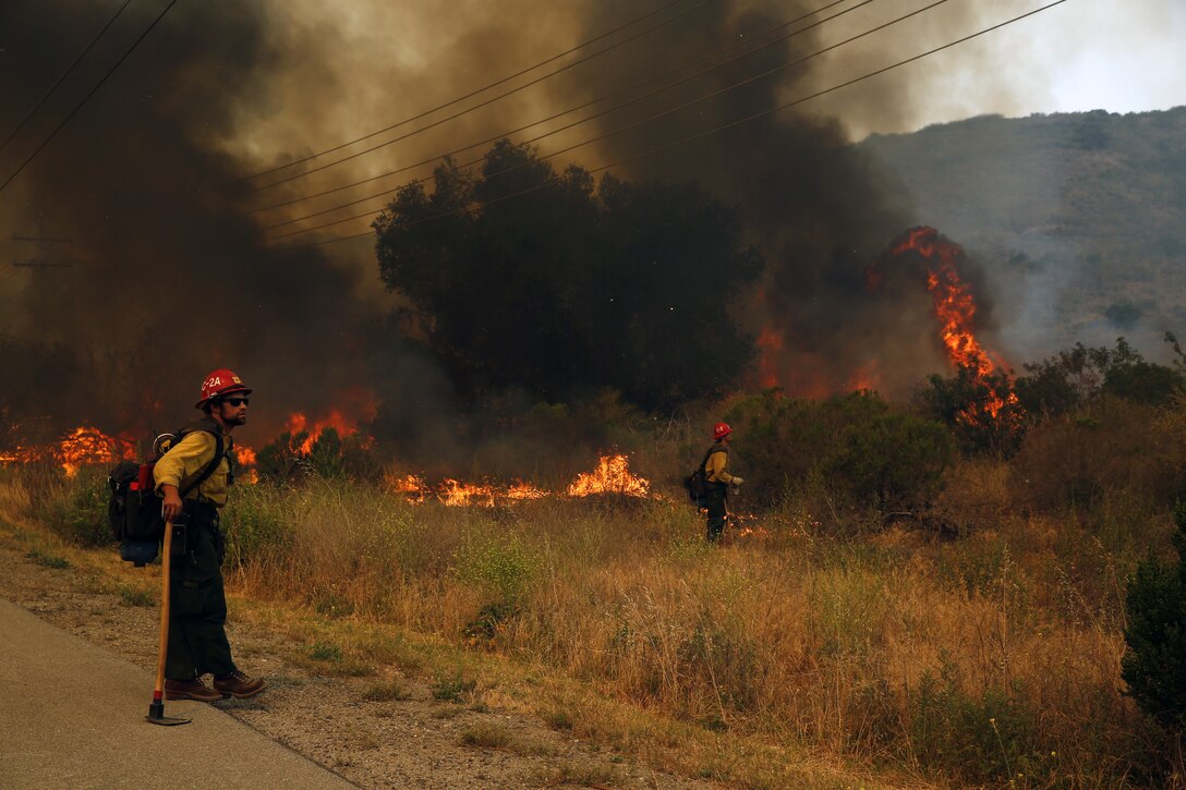 The School of Infantry-West (52 Area) evacuation order has been lifted. All personnel can return via the I-5 and Basilone Rd. gate to the 52 Area.

The San Mateo Fire (Combat Fire) that was reported at 11:24 a.m. Friday has burned 1,000 acres and is currently listed as 25% contained. The Las Pulgas fire first reported at 3:15 p.m. Thursday has burned 15,000 acres and is listed at 40% containment.  The Tomahawk fire that started Wednesday on Naval Weapons Station Fallbrook is currently listed at 6,500 acres burned and 75% containment.

Evacuation orders for Camp San Mateo (62 Area), Camp Las Pulgas (43 Area), Camp Las Flores (41 Area), Camp Margarita (33 Area), Marine Air Support Squadron 3 (32 Area) and Camp Vado Del Rio (25 Area) remain in effect.

Road Closures:

The Las Pulgas gate and Las Pulgas Road remain closed to all traffic except emergency vehicles.

The Christianitos Gate is closed to all traffic except emergency vehicles.

The San Mateo Road between Camp San Mateo and Camp San Onofre is closed.

The Naval Weapons Station Fallbrook gate and Ammunition Road remain closed.

Basilone Road from Marine Corps Air Station Camp Pendleton to Camp Horno remains closed.

Stuart Mesa Road north of Assault Craft Unit-5 to the Las Pulgas Gate remains closed.

The causes of the fires are under investigation.
