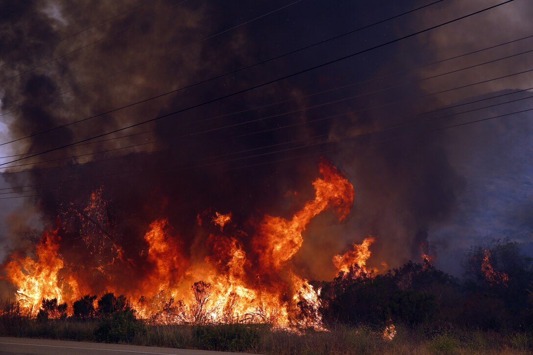 The School of Infantry-West (52 Area) evacuation order has been lifted. All personnel can return via the I-5 and Basilone Rd. gate to the 52 Area.

The San Mateo Fire (Combat Fire) that was reported at 11:24 a.m. Friday has burned 1,000 acres and is currently listed as 25% contained. The Las Pulgas fire first reported at 3:15 p.m. Thursday has burned 15,000 acres and is listed at 40% containment.  The Tomahawk fire that started Wednesday on Naval Weapons Station Fallbrook is currently listed at 6,500 acres burned and 75% containment.

Evacuation orders for Camp San Mateo (62 Area), Camp Las Pulgas (43 Area), Camp Las Flores (41 Area), Camp Margarita (33 Area), Marine Air Support Squadron 3 (32 Area) and Camp Vado Del Rio (25 Area) remain in effect.

Road Closures:

The Las Pulgas gate and Las Pulgas Road remain closed to all traffic except emergency vehicles.

The Christianitos Gate is closed to all traffic except emergency vehicles.

The San Mateo Road between Camp San Mateo and Camp San Onofre is closed.

The Naval Weapons Station Fallbrook gate and Ammunition Road remain closed.

Basilone Road from Marine Corps Air Station Camp Pendleton to Camp Horno remains closed.

Stuart Mesa Road north of Assault Craft Unit-5 to the Las Pulgas Gate remains closed.

The causes of the fires are under investigation.
