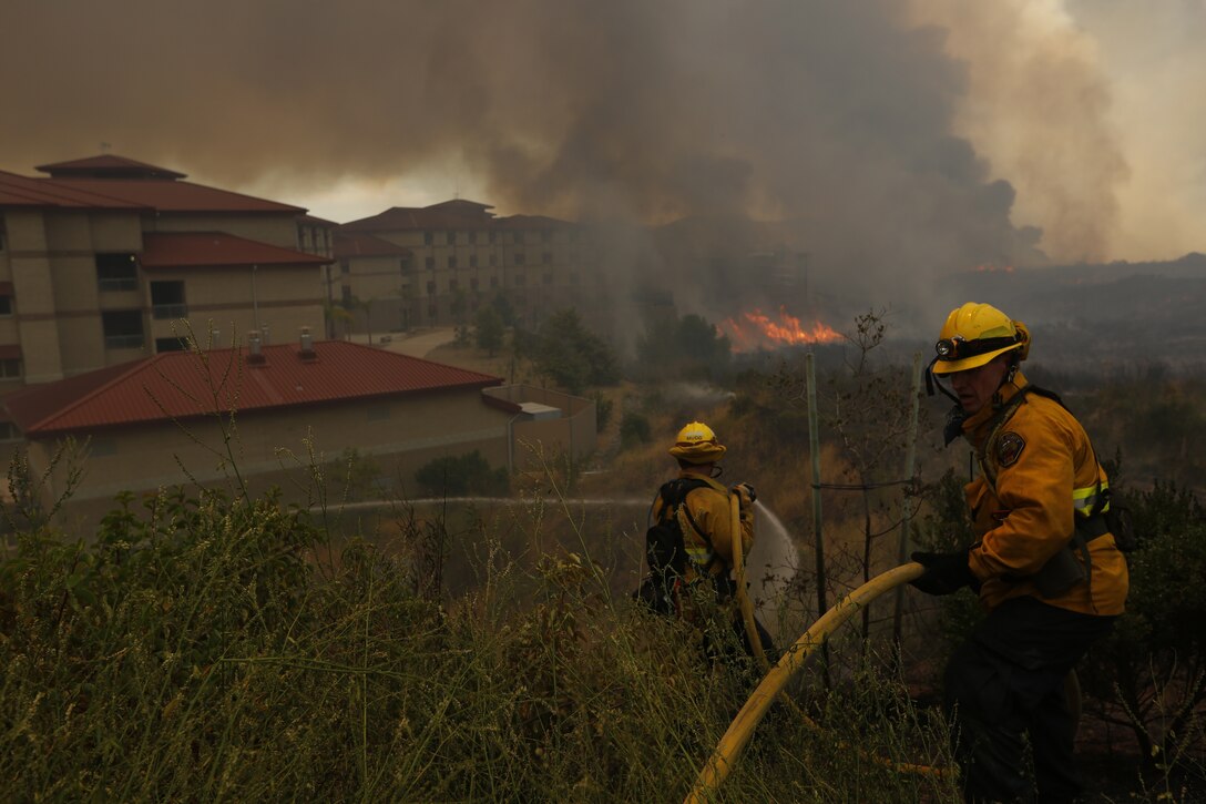 The School of Infantry-West (52 Area) evacuation order has been lifted. All personnel can return via the I-5 and Basilone Rd. gate to the 52 Area.

The San Mateo Fire (Combat Fire) that was reported at 11:24 a.m. Friday has burned 1,000 acres and is currently listed as 25% contained. The Las Pulgas fire first reported at 3:15 p.m. Thursday has burned 15,000 acres and is listed at 40% containment.  The Tomahawk fire that started Wednesday on Naval Weapons Station Fallbrook is currently listed at 6,500 acres burned and 75% containment.

Evacuation orders for Camp San Mateo (62 Area), Camp Las Pulgas (43 Area), Camp Las Flores (41 Area), Camp Margarita (33 Area), Marine Air Support Squadron 3 (32 Area) and Camp Vado Del Rio (25 Area) remain in effect.

Road Closures:

The Las Pulgas gate and Las Pulgas Road remain closed to all traffic except emergency vehicles.

The Christianitos Gate is closed to all traffic except emergency vehicles.

The San Mateo Road between Camp San Mateo and Camp San Onofre is closed.

The Naval Weapons Station Fallbrook gate and Ammunition Road remain closed.

Basilone Road from Marine Corps Air Station Camp Pendleton to Camp Horno remains closed.

Stuart Mesa Road north of Assault Craft Unit-5 to the Las Pulgas Gate remains closed.

The causes of the fires are under investigation.
