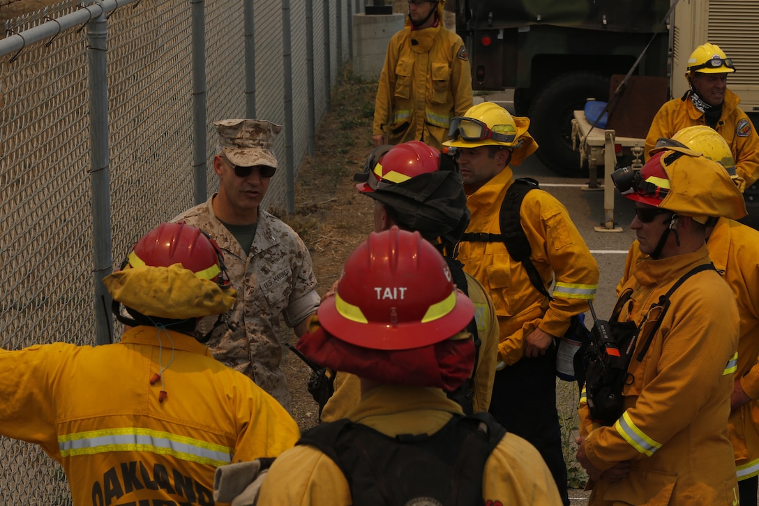 Brig. Gen. John W. Bullard surveys the fire in the Las Pulgas Area. The Las Pulgas fire started at 3:15 p.m. Thursday and effected Camp las Pulgas, Camp Margarita, Camp Las Flores, the 32 Area, the 22 Area and the 23 Area. Camp Las Pulgas was evacuated to the School of Infantry parade deck, Camp Las Flores, Camp Margarita and the 32 Area were evacuated to the I MEF parade deck in Camp Del Mar. The 22 and 23 Areas were ordered to shelter in place. Bullard is the commanding general of Marine Corps Installations West and Marine Corps Base Camp Pendleton. 