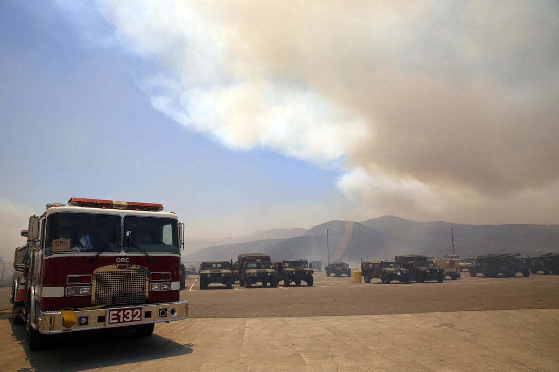 The School of Infantry-West (52 Area) evacuation order has been lifted. All personnel can return via the I-5 and Basilone Rd. gate to the 52 Area.

The San Mateo Fire (Combat Fire) that was reported at 11:24 a.m. Friday has burned 1,000 acres and is currently listed as 25% contained. The Las Pulgas fire first reported at 3:15 p.m. Thursday has burned 15,000 acres and is listed at 40% containment.  The Tomahawk fire that started Wednesday on Naval Weapons Station Fallbrook is currently listed at 6,500 acres burned and 75% containment.

Evacuation orders for Camp San Mateo (62 Area), Camp Las Pulgas (43 Area), Camp Las Flores (41 Area), Camp Margarita (33 Area), Marine Air Support Squadron 3 (32 Area) and Camp Vado Del Rio (25 Area) remain in effect.

Road Closures:

The Las Pulgas gate and Las Pulgas Road remain closed to all traffic except emergency vehicles.

The Christianitos Gate is closed to all traffic except emergency vehicles.

The San Mateo Road between Camp San Mateo and Camp San Onofre is closed.

The Naval Weapons Station Fallbrook gate and Ammunition Road remain closed.

Basilone Road from Marine Corps Air Station Camp Pendleton to Camp Horno remains closed.

Stuart Mesa Road north of Assault Craft Unit-5 to the Las Pulgas Gate remains closed.

The causes of the fires are under investigation.
