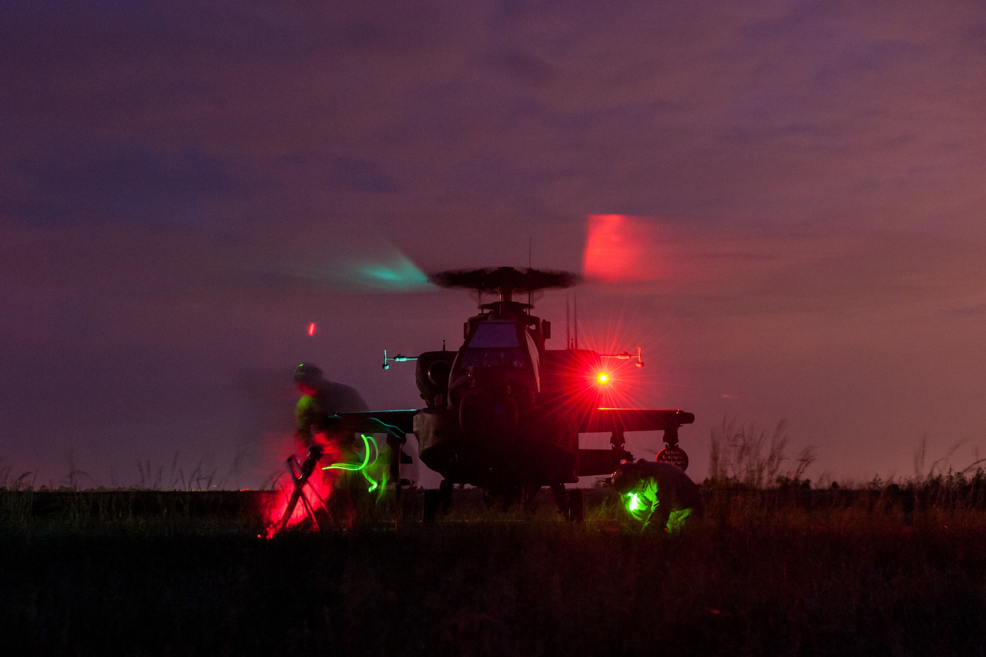 U.S. Marines assigned to the 273rd Marine Wing Support Squadron, Air Operations Company, from Marine Corps Air Station Beaufort, S.C., fuel a South Carolina National Guard AH-64 Apache at a forward air refueling point at McEntire Joint National Guard Base, S.C. on May 14, 2014.  Elements of the South Carolina Air and Army National Guard and the U.S. Marines conduct joint operations which are crucial to the ongoing success of operational readiness and deployments around the world.  (U.S. Air National Guard photo by Tech Sgt. Jorge Intriago/Released)