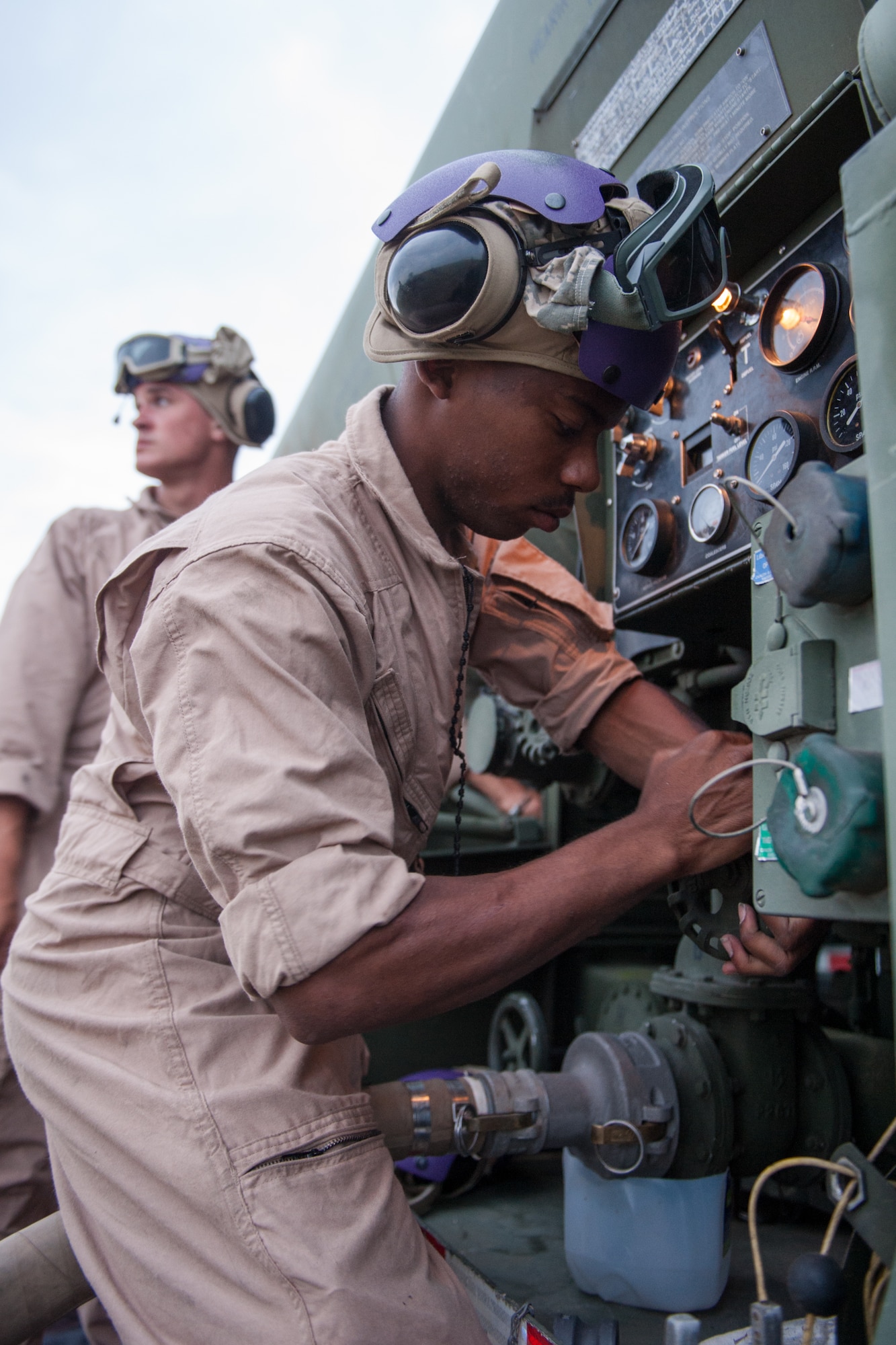 U.S. Marine Cpl. Eric A. Robinson, assigned to the 273rd Marine Wing Support Squadron, Air Operations Company, stops the transfer of fuel from an N-90 fuel truck to a rotary wing aircraft during forward air refueling point operations at McEntire Joint National Guard Base, S.C. on May 14, 2014. Elements of the South Carolina Air and Army National Guard and the U.S. Marines conduct joint operations which are crucial to the ongoing success of operational readiness and deployments around the world.  (U.S. Air National Guard photo by Tech Sgt. Jorge Intriago/Released)