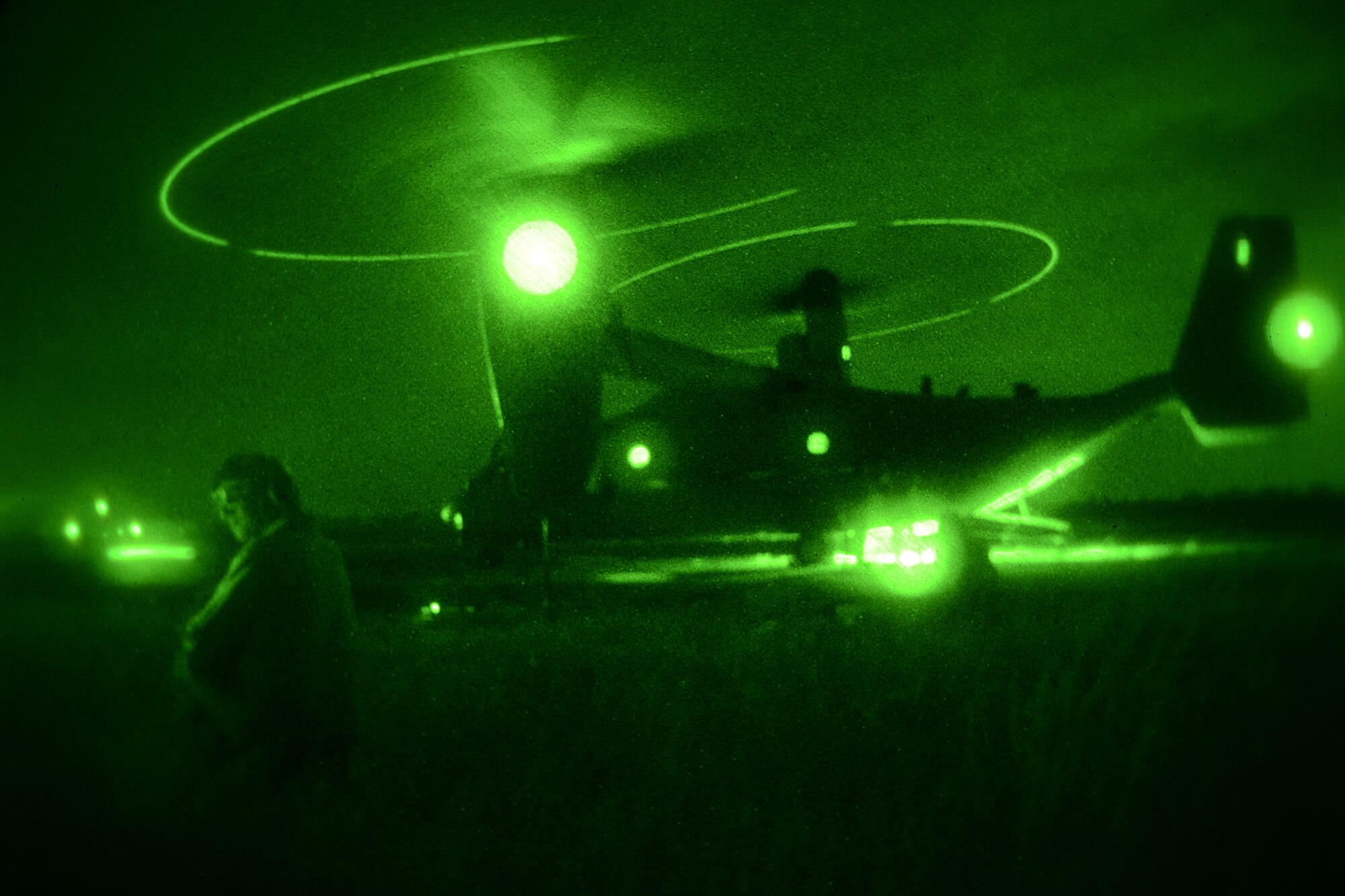 Night vision photo of U.S. Marines assigned to the 273rd Marine Wing Support Squadron, Air Operations Company, Fuels Platoon stationed at Marine Corps Air Station Beaufort, S.C., fuel an MV-22 Osprey during forward air refueling point operation with the South Carolina National Guard at McEntire Joint National Guard Base, S.C. on May 14.  Elements of the South Carolina Air and Army National Guard and the U.S. Marines conduct joint operations which are crucial to the ongoing success of operational readiness and deployments around the world.  (U.S. Air National Guard photo by Airman 1st Class Ashleigh S. Pavelek/Released) 