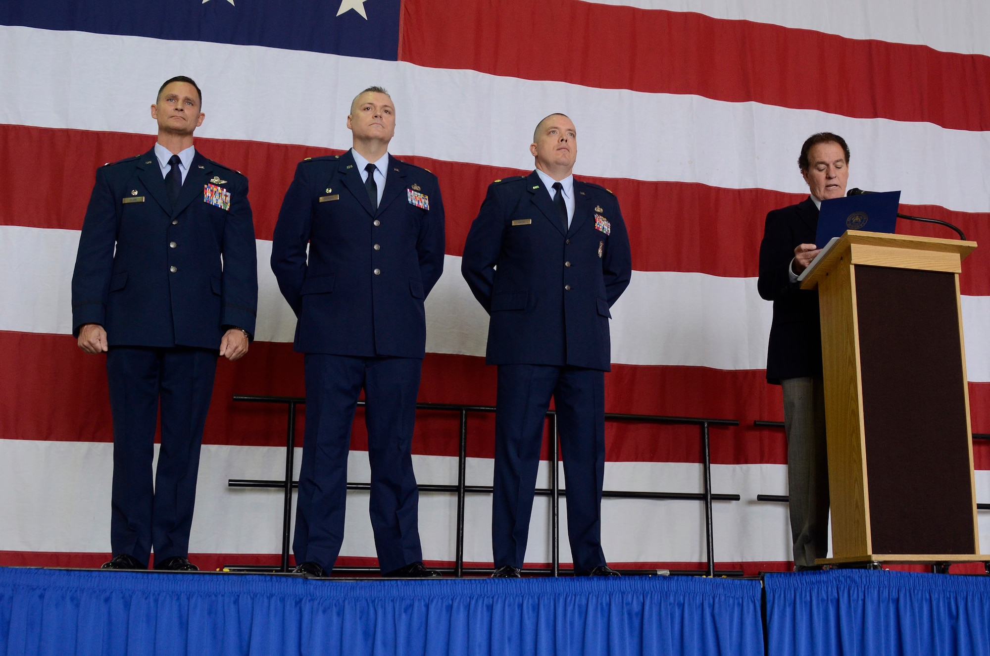 In recognition of the 94th Security Forces and 80th Aerial Port Squadrons achievement of being second to none in the Air Force, from the right, U.S. Rep. Phil Gingrey of Georgia awards to Maj. Robert Mayes, 94th SFS operations officer, Maj. Kelly Bronson, 80th APS commander, and Col. Brett Clark, 94th Airlift Wing commander, at the 2014 Academy Day, Dobbins Air Reserve Base, Ga., May 17. (U.S. Air Force photo/Don Peek)