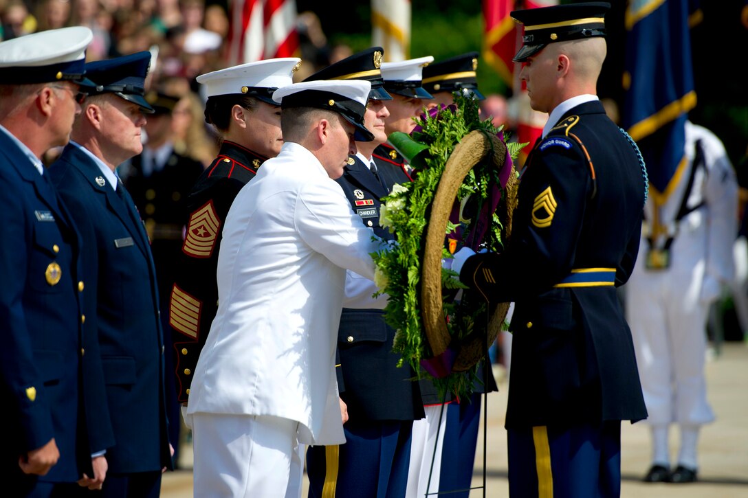 Master Chief Petty Officer of the Navy Michael D. Stevens affixes his ...