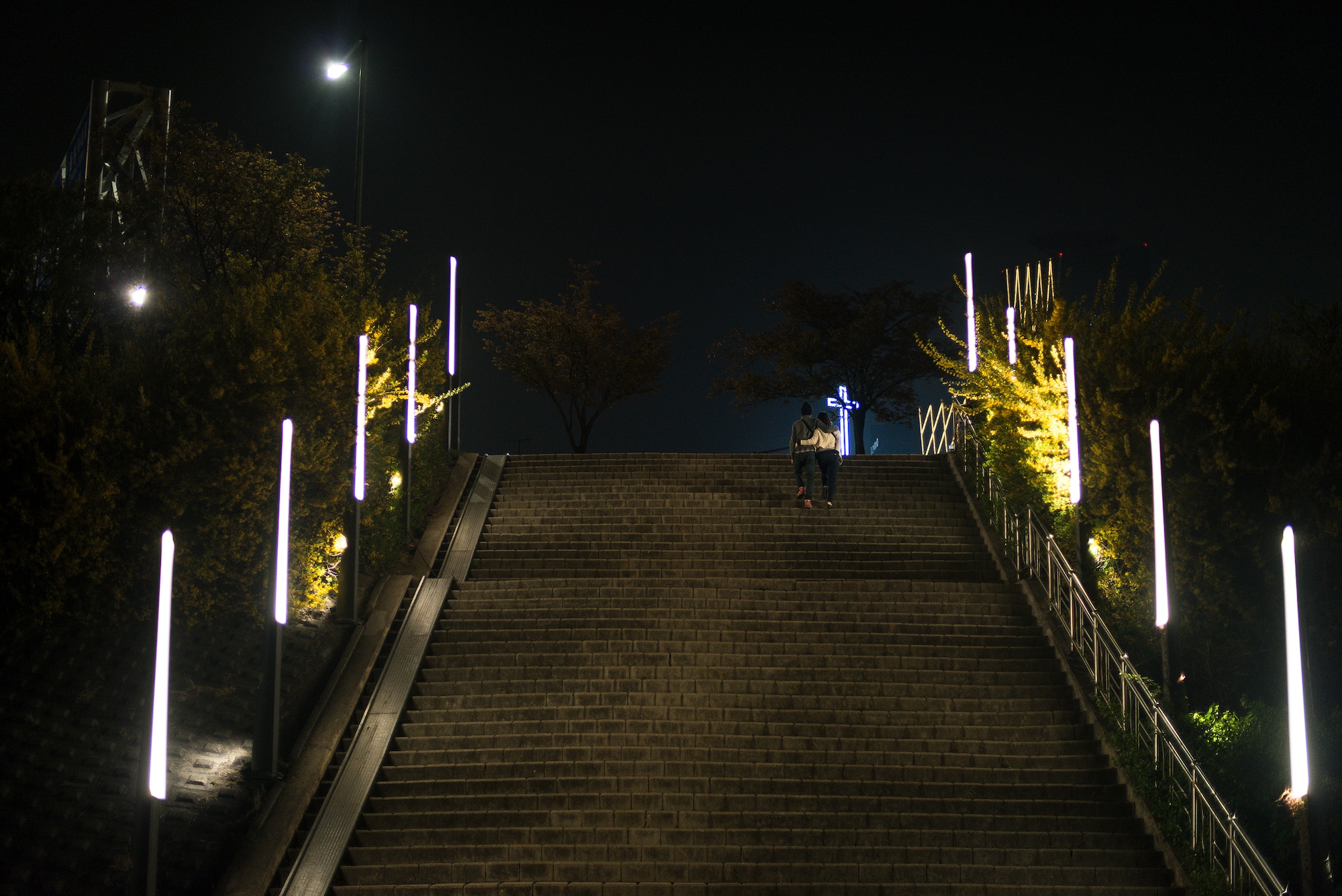 A couple exits Yeouido Park April 12, 2014, in Seoul, Republic of Korea. The park is accessible daily throughout the year. (U.S. Air Force photo by Staff Sgt. Jake Barreiro)