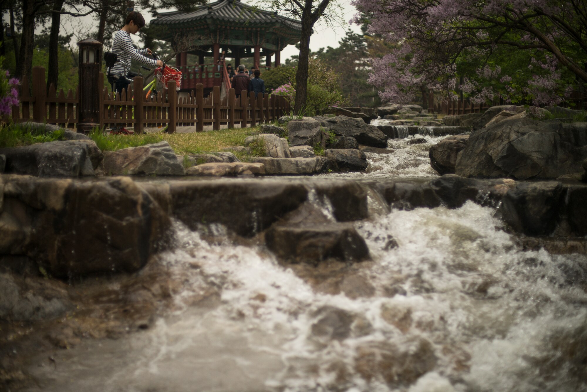 Water flows down rocks in Yeouido Park April 12, 2014, in Seoul, Republic of Korea. The park has several ecological attractions including a small preserved forest. (U.S. Air Force photo by Staff Sgt. Jake Barreiro)