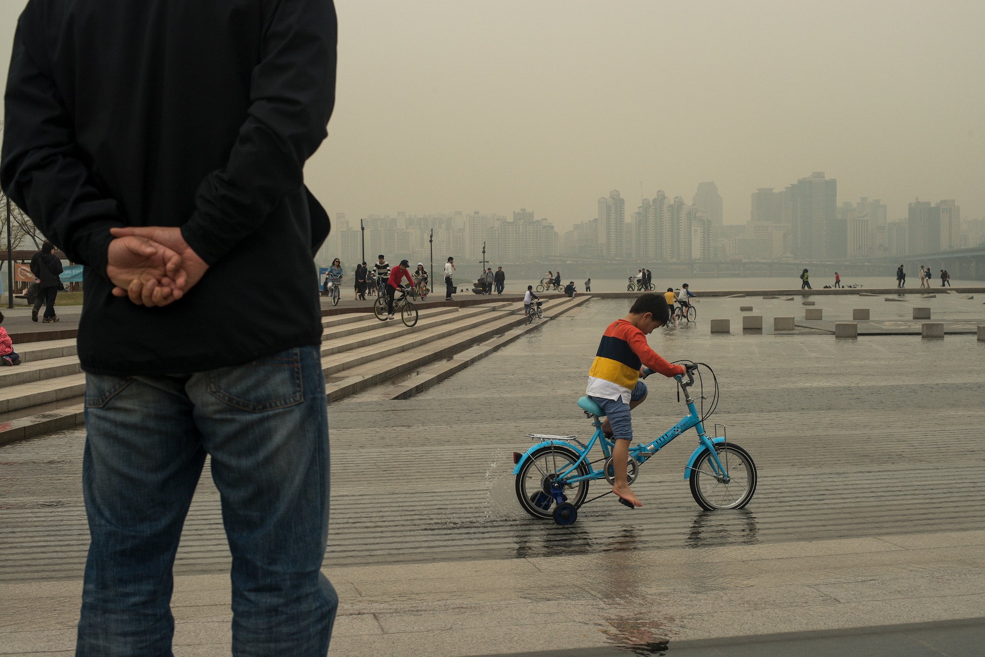 A child pedals his bike in Yeouido Park April 12, 2014, in Seoul, Republic of Korea. The park is located next to the Han River, and is a popular afternoon destination in the spring and summer. (U.S. Air force photo by Staff Sgt. Jake Barreiro)