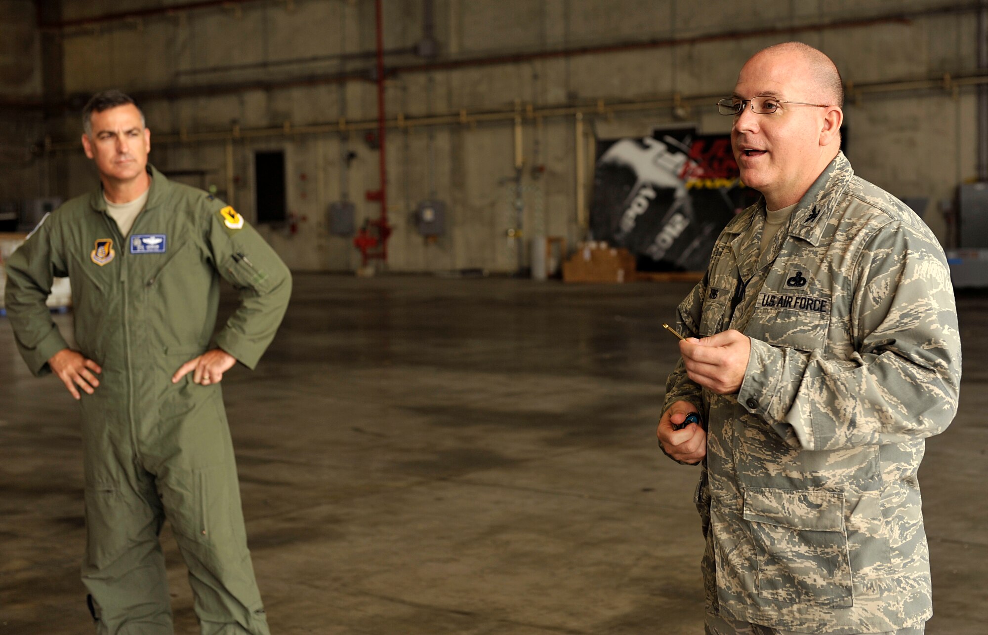 U.S. Air Force Col. Jeffrey King, 18th Maintenance Group commander, thanks members of the 18th MXG and members of Boeing before presenting coins to them on Kadena Air Base, Japan, May 15, 2014. Fifteen members from Boeing came to Kadena in August 2012 to replace the radar system for the F-15 Eagles stationed here. (U.S. Air Force photo by Naoto Anazawa)