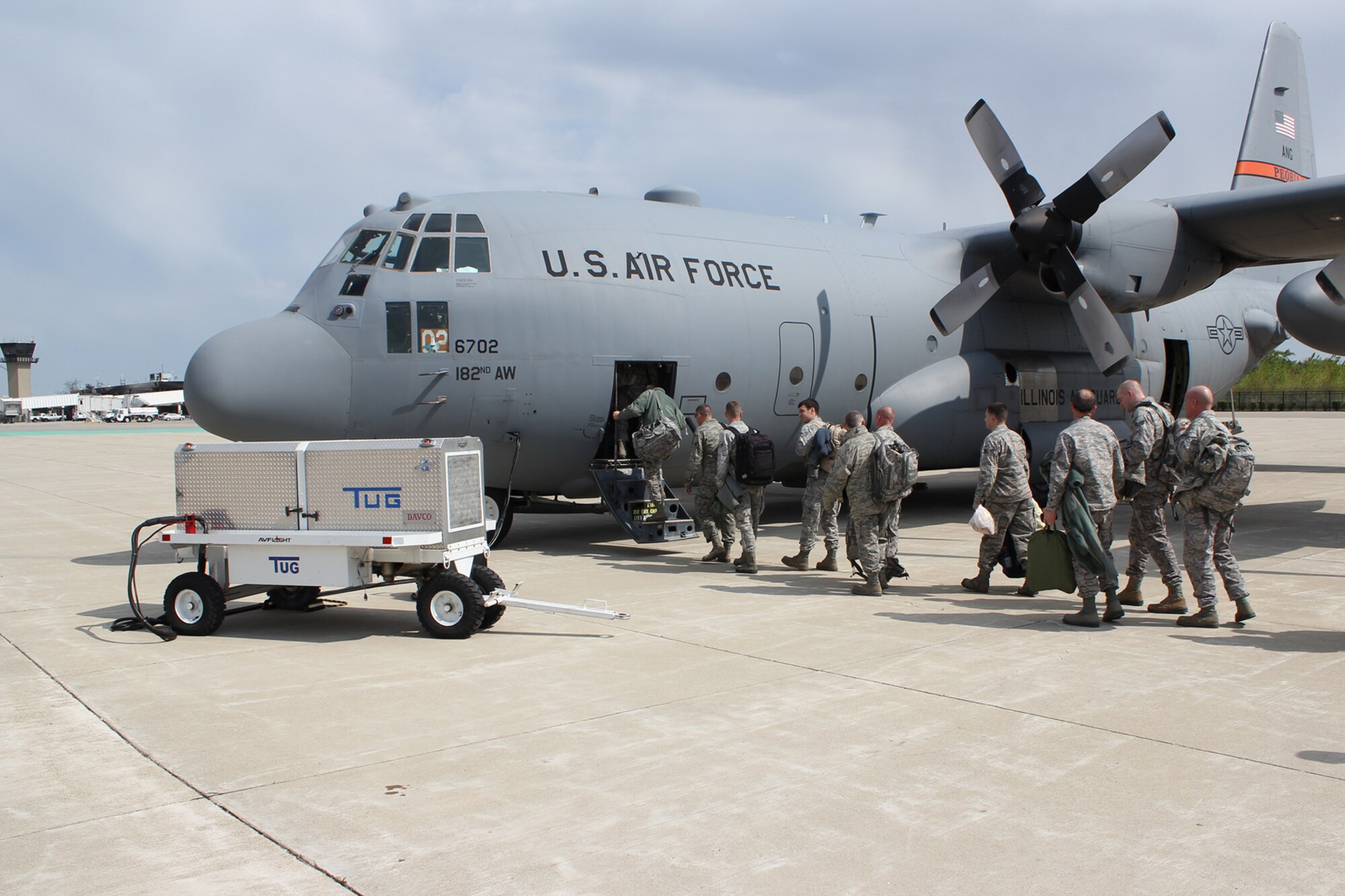Airmen from the 127th Civil Engineer Squadron board a C-130 Hercules aircraft at Coleman A. Young Airport in Detroit, May 18, 2014. While the taxiways at Selfridge Air National Guard Base, Mich., are undergoing routine maintenance, the Michigan Air National Guard was able to utilize the nearby airport in Detroit – popularly known as City Airport --  as the 127CES Airmen were traveling to Maine for a training deployment. The availability of the Detroit airport to use as an alternate site provides significant flexibility to the Michigan Air National Guard. Other Michigan ANG aircraft have been operating from Detroit Metropolitan Airport in Romulus, Mich., during the taxiway work at Selfridge. The C-130 is operated by the 182nd Airlift Wing, Illinois National Guard. (U.S. Air National Guard photo by Technical Sgt. Rachel Barton/Released)