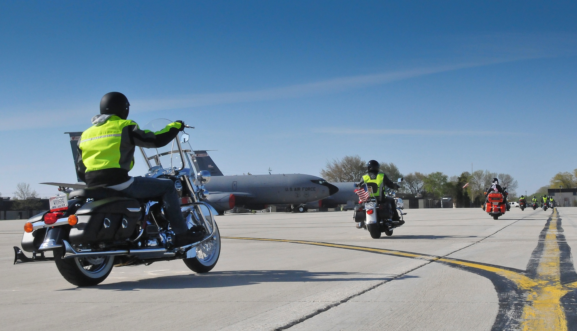A group of motorcyclists exit the 128th Air Refueling Wing’s ramp and proceed to an Armed Forces Day event, Milwaukee, May 17, 2014. (U.S. Air National Guard photo by Staff Sgt. Jeremy Wilson/Released)
