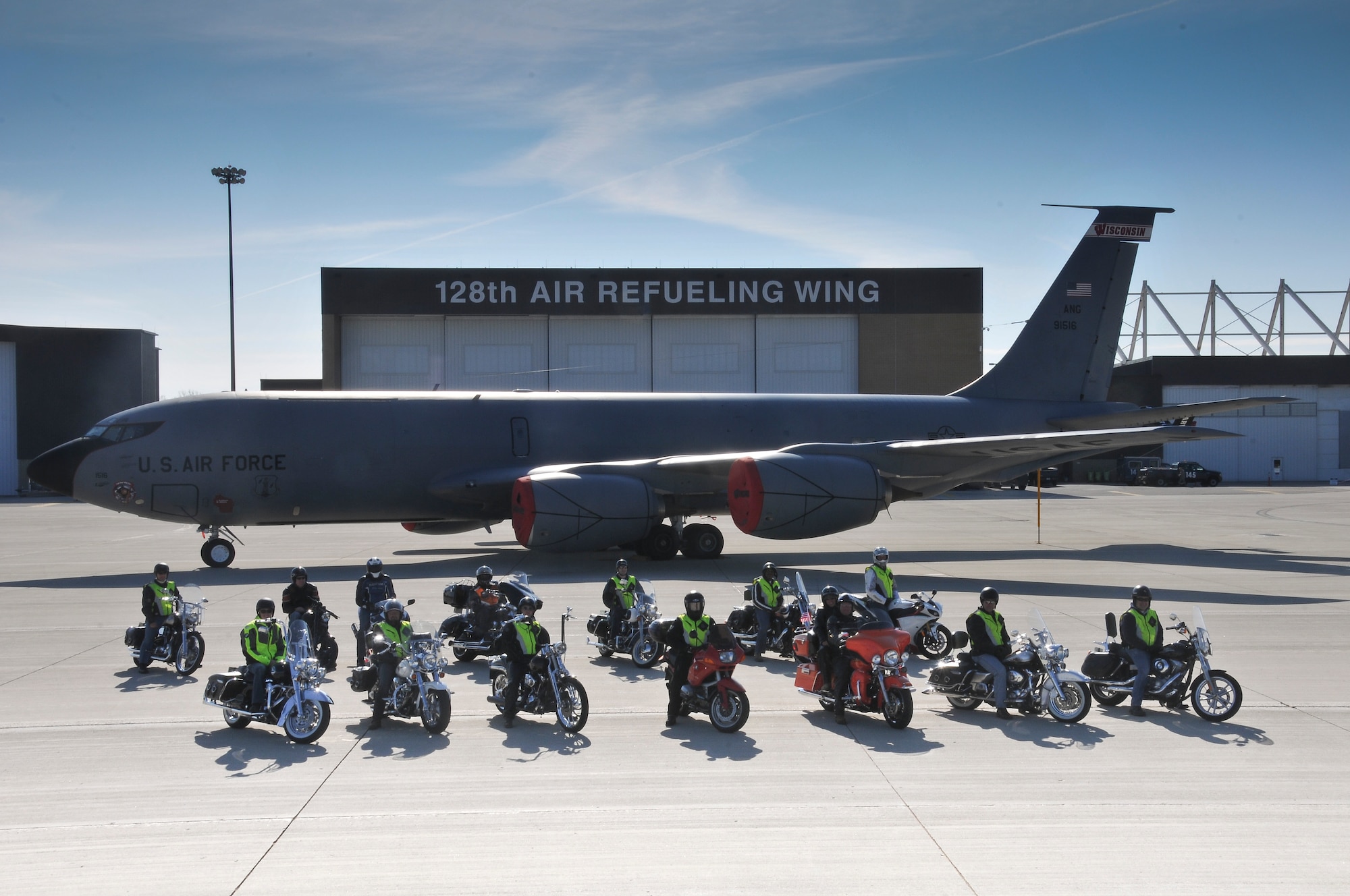 After successfully completing a motorcycle safety course, a group of motorcyclists pose with their motorcycles and a KC-135R Stratotanker on the 128th Air Refueling Wing’s ramp, Milwaukee, May 17, 2014. (U.S. Air National Guard photo by Staff Sgt. Jeremy Wilson/Released)