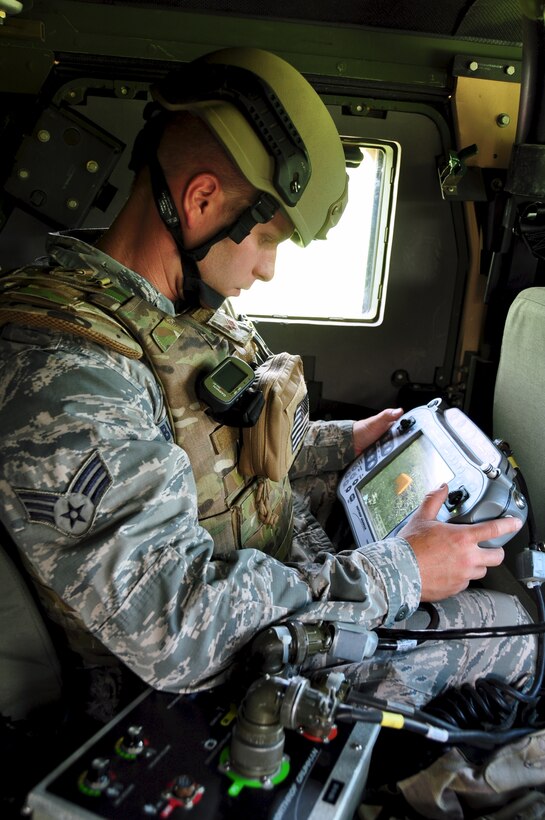 Senior Airman, Kody Bloodworth, 932nd Explosive Ordnance Disposal Technician, utilizes remote robotic procedures to investigate a possible simulated threat in route to location during training on Scott Air Force Base, Il, May. 17, 2014.  Two separate teams trained to simulate a wartime environment, one mounted, in the humvee with equipment, and one dismounted, with members on foot.  The talented EOD members train on a monthly basis in the Air Force Reserve Command unit in Illinois, and are responsible for responding to real world threats. (U.S. Air Force Photo/ Staff Sgt. Amber Hodges)