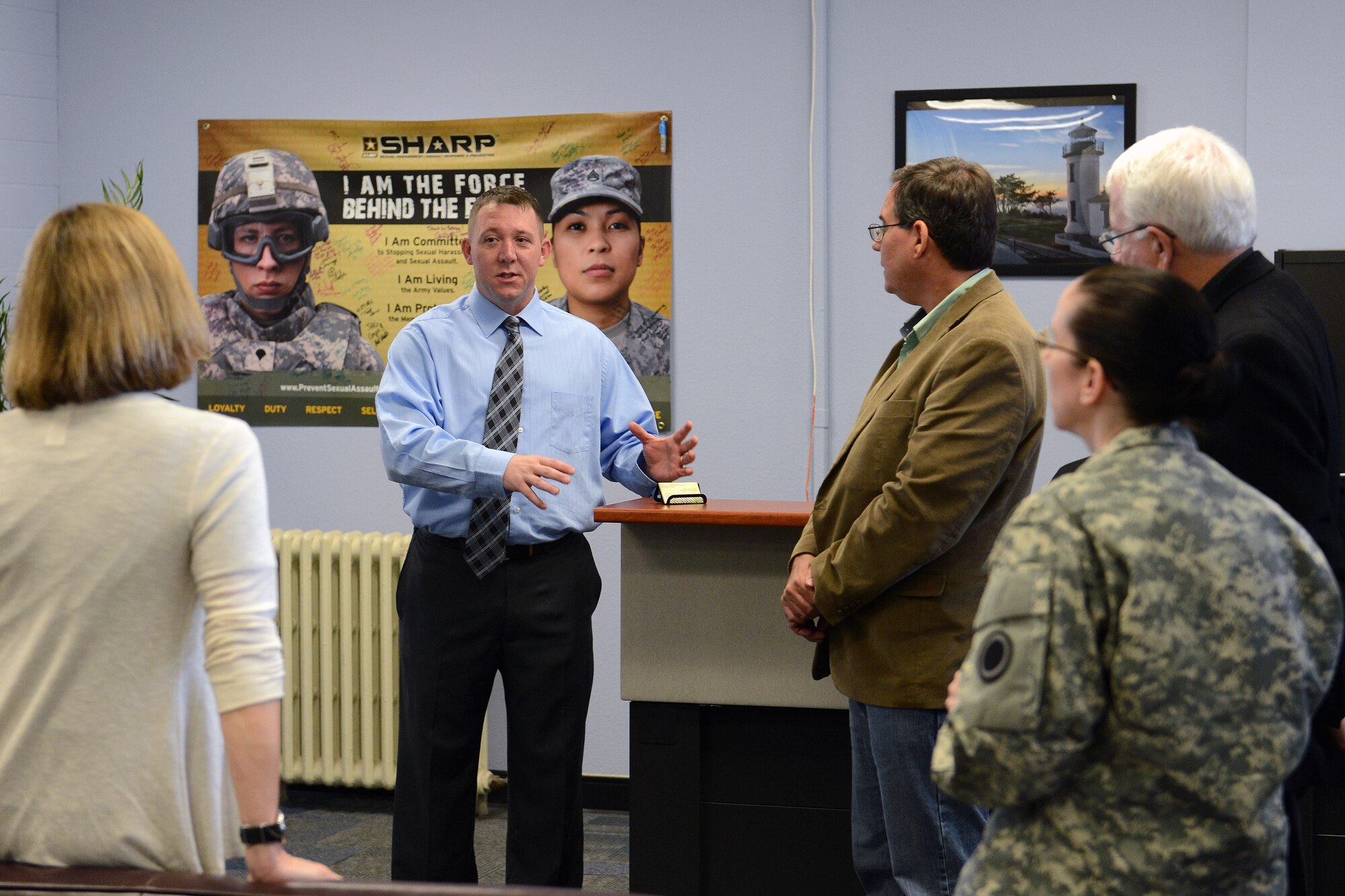 Staff Sgt. Jerry Shore, Sexual Harassment and Assault Response Prevention program victim advocate, tells members of the Secretary of the Air Force’s Scientific Advisory Board about the Sharp program May 14, 2014, at Joint Base Lewis-McChord, Wash. The AF SAB visited JBLM as part of a continuing study examining the sexual assault challenges facing the Air Force today.  (U.S. Air Force photo/Airman 1st Class Jacob Jimenez)       