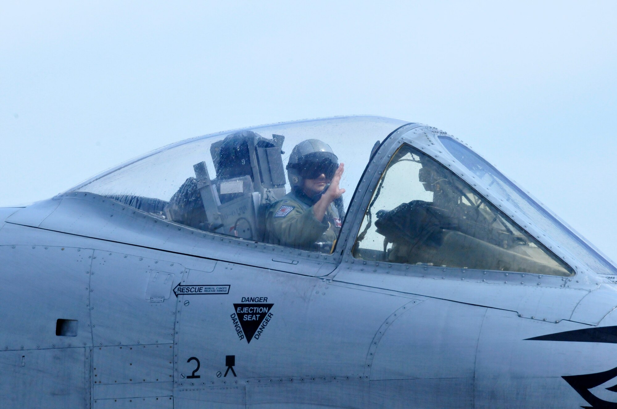 Lt. Col. Marty Dahlem, 188th Operations Support Squadron commander, waves to onlookers after he and Maj. Doug Davis, 188th Detachment 1 commander, flew the 188th Fighter Wing’s final A-10 Thunderbolt II “Warthog” training mission May 16, 2014, at Ebbing Air National Guard Base, Fort Smith, Arkansas. (U.S. Air National Guard photo by Tech Sgt. Josh Lewis/released)