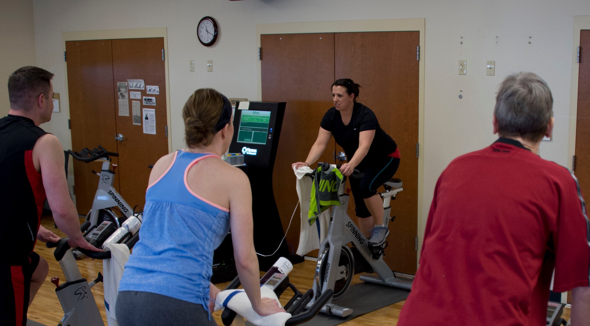 Master Sgt. Crystal Galloway, center, teaches a spin class in St. Paul, Minn., Apr. 2, 2014. Galloway has been teaching the class for the last two years.
(U.S. Air National Guard photo by Tech. Sgt. Amy M. Lovgren/Released)
