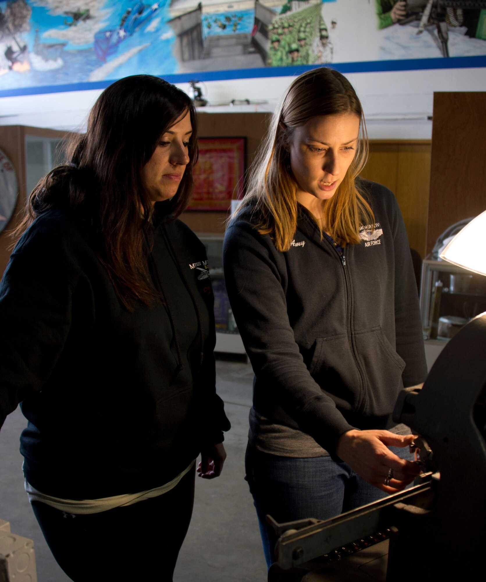 Master Sgt. Crystal Galloway, left, learns how to use a dog tag making machine from Amy Lauria in South St. Paul, Minn., Apr. 2, 2014. Galloway has been volunteering at the Commemorative Air Force Minnesota Wing for the last couple of years by helping them with social media postings and the organization and promotion of events.
(U.S. Air National Guard photo by Tech. Sgt. Amy M. Lovgren/Released)
