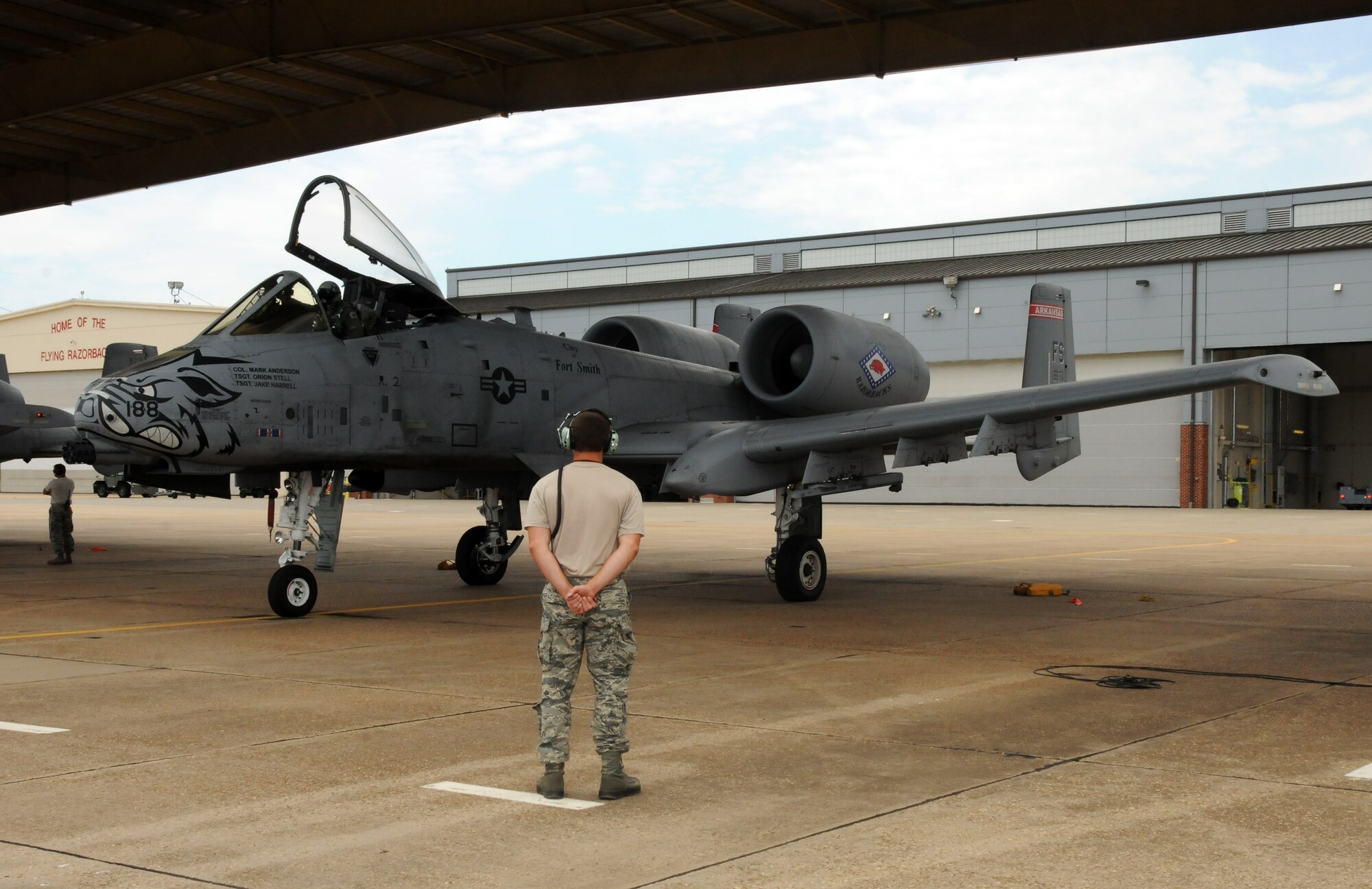 Lt. Col. Marty Dahlem, 188th Operations Support Squadron commander prepares to taxi May 16, 2014, at Ebbing Air National Guard Base, Fort Smith, Arkansas, as Tech Sgt. Orion Stell, a crew chief with the 188th Aircraft Maintenance Squadron, waits for the signal to taxi from Dahlem. Dahlem and Maj. Doug Davis, 188th Detachment 1 commander, performed the 188th’s final A-10 Thunderbolt II “Warthog” training mission. (U.S. Air National Guard photo by Maj. Heath Allen/released)
