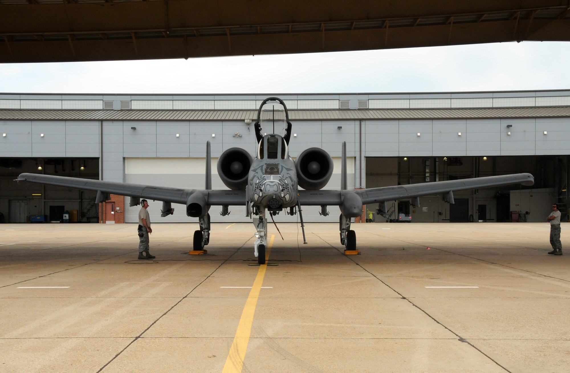 Maj. Doug Davis, 188th Detachment 1 commander, prepares to taxi May 16, 2014, at Ebbing Air National Guard Base as Master Sgt. Justin Likens, a crew chief with the 188th Aircraft Maintenance Squadron, left, works through pre-flight checks and Master Sgt. Gary Childers, a quality assurance specialist with the 188th Maintenance Group, observes. Davis and Lt. Col. Marty Dahlem, 188th Operations Support Squadron commander, performed the 188th’s final A-10 Thunderbolt II “Warthog” training mission. (U.S. Air National Guard photo by Maj. Heath Allen/released)