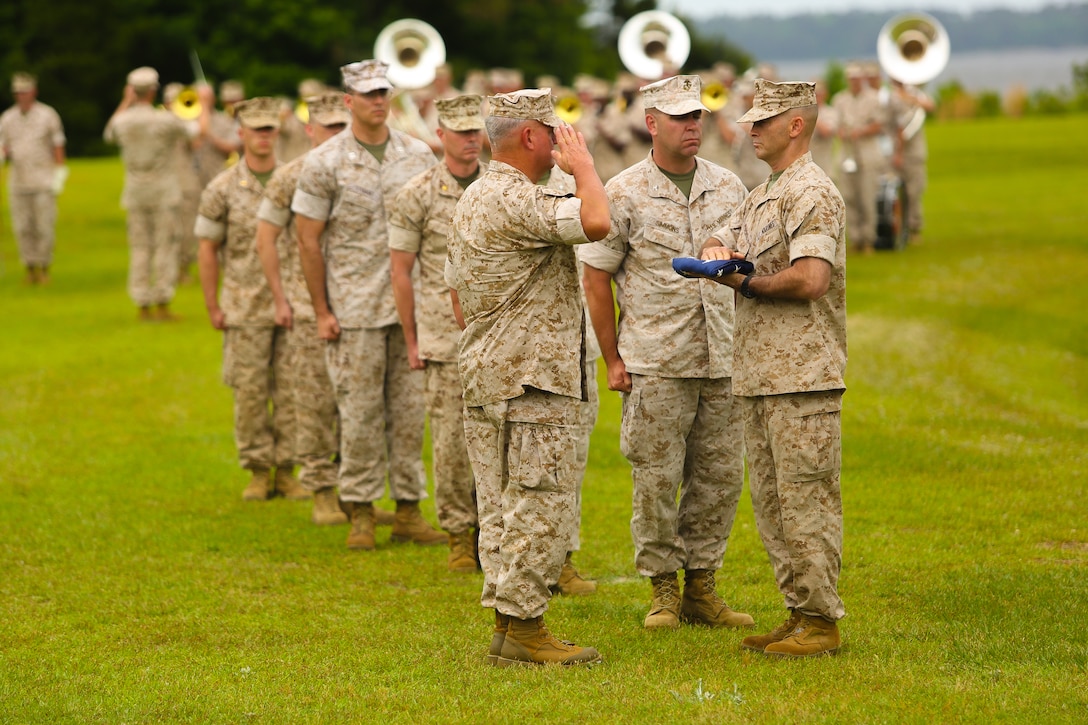 Maj. Gen. Charles M. Gurganus, previously the deputy commanding general of Marine Corps Combat Development Command, salutes the American flag as it is presented to him during his retirement ceremony May 15, 2014, aboard Marine Corps Base Camp Lejeune, N. C. Gurganus is retiring after 38 years of faithful service to the Marine Corps and will be returning to his hometown of Wilmington, N.C.

