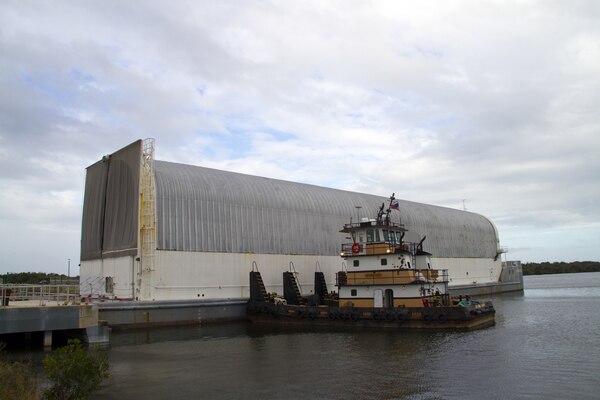 The Pegasus Barge, with its tugboat escort, readies for departure from NASA's Kennedy Space Center, Florida, bound for NASA's Stennis Space Center near Bay St. Louis, Mississippi. NASA partnered with USACE's Marine Design Center to refurbish the barge. It will be used to transport rocket components for NASA's next-generation Space Launch System (SLS) between manufacturing, testing and launch locations.