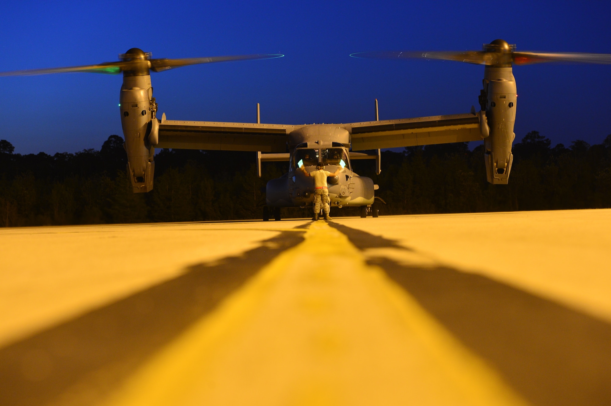 A CV-22 Osprey sits on the flight line May 3, 2014, during Emerald Warrior 14 at Hurlburt Field, Fla. Emerald Warrior is a U.S. Special Operations Command-sponsored two-week joint/combined tactical exercise designed to provide realistic military training in an urban setting. (U.S. Air Force photo/Airman 1st Class Jasmonet Jackson)