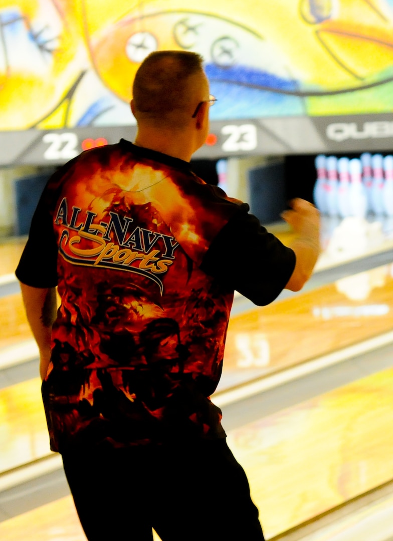 Navy Chief Warrant Officer 4 Jeff Gac, All-Navy Bowling Team, celebrates after getting a strike during the 2014 Armed Forces Bowling Championship at Joint Base Lewis-McChord, Wash., May 16.