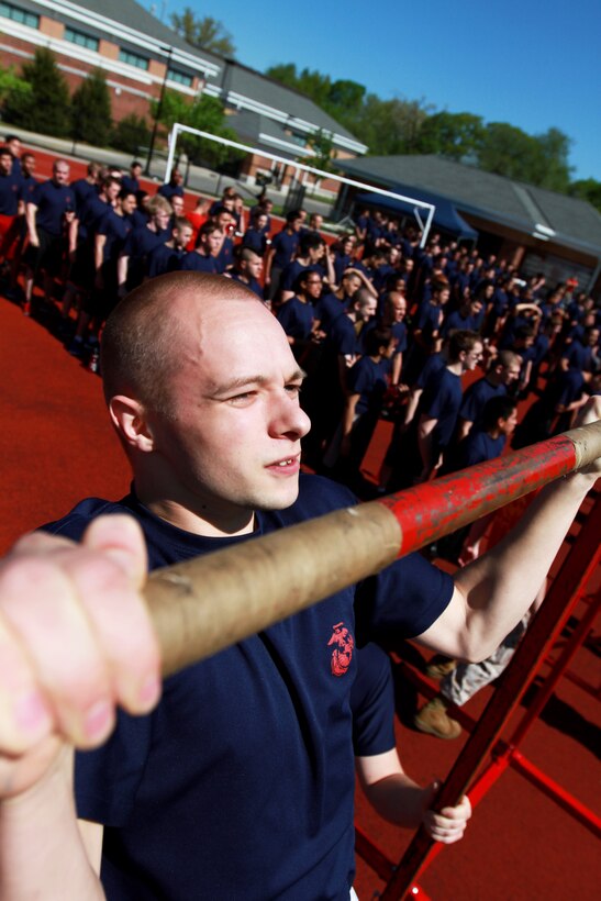 Brent Holmes, a Plymouth, Mass., native, preforms pull-ups during the 2014 Annual Field Meet, at Chicopee High School’s Football Field, May 17, 2014. Approximately 450 newly enlisted men and women from across New England, to include; Western Massachusetts, Connecticut, and Rhode Island, attended the event. The annual Marine Corps event is designed to test the Poolees’ physical fitness with a pull-up and sit-up competition to ensure that they are prepared for the rigors of Marine Corps boot camp. (Official Marine Corps Photo by Sgt. Richard Blumenstein)