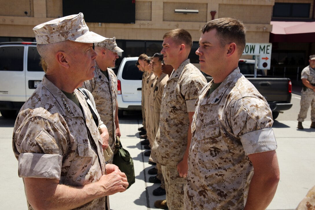 The 35th Commandant of the Marine Corps General James F. Amos, the 17th Sergeant Major of the Marine Corps Sgt. Maj. Micheal P. Barrett visit Marine Corps Base Camp Pendleton to speak with Marines who participated in firefighting efforts during the Basilone Complex Fire. The Marines worked day and night on the ground and in the air to combat the multiple blazes across the base.