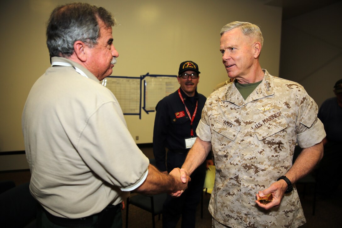 The 35th Commandant of the Marine Corps General James F. Amos, the 17th Sergeant Major of the Marine Corps, Sgt. Maj. Micheal P. Barrett visit Marine Corps Base Camp Pendleton to speak with the local, state and federal firefighting departments who participated in firefighting efforts during the Basilone Complex Fire. Camp Pendleton Fire Department, CAL FIRE, the U.S. Forest Service, and many more local fire departments combined their efforts with military assets to combat the blazes across the base.