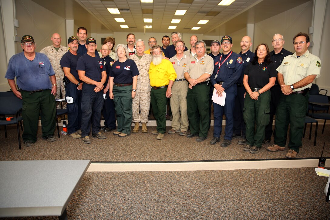 The 35th Commandant of the Marine Corps General James F. Amos, the 17th Sergeant Major of the Marine Corps, Sgt. Maj. Micheal P. Barrett visit Marine Corps Base Camp Pendleton to speak with the local, state and federal firefighting departments who participated in firefighting efforts during the Basilone Complex Fire. Camp Pendleton Fire Department, CAL FIRE, the U.S. Forest Service, and many more local fire departments combined their efforts with military assets to combat the blazes across the base.
