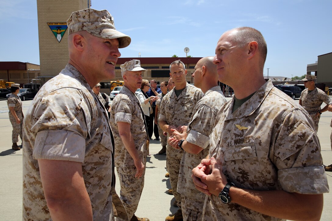 The 35th Commandant of the Marine Corps General James F. Amos, the 17th Sergeant Major of the Marine Corps Sgt. Maj. Micheal P. Barrett visit Marine Corps Base Camp Pendleton to speak with Marines who participated in firefighting efforts during the Basilone Complex Fire. The Marines worked day and night on the ground and in the air to combat the multiple blazes across the base.