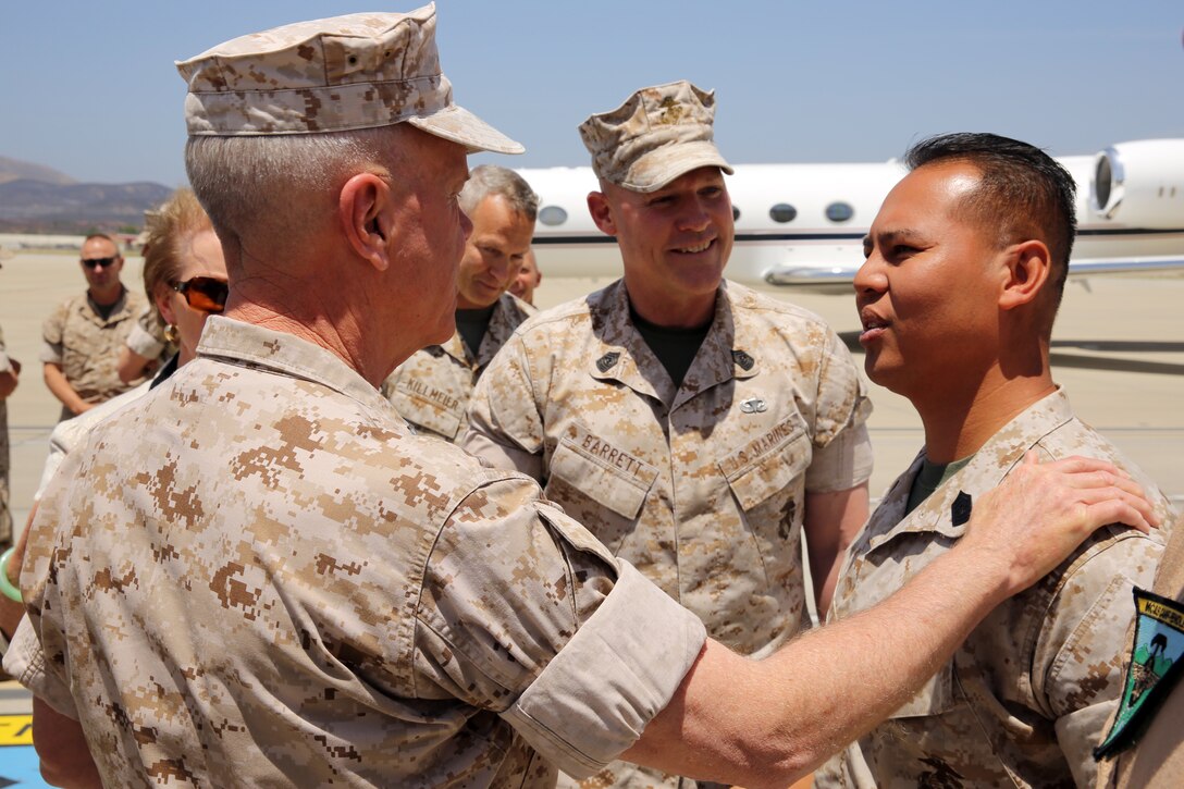 The 35th Commandant of the Marine Corps General James F. Amos, the 17th Sergeant Major of the Marine Corps Sgt. Maj. Micheal P. Barrett visit Marine Corps Base Camp Pendleton to speak with Marines who participated in firefighting efforts during the Basilone Complex Fire. The Marines worked day and night on the ground and in the air to combat the multiple blazes across the base.