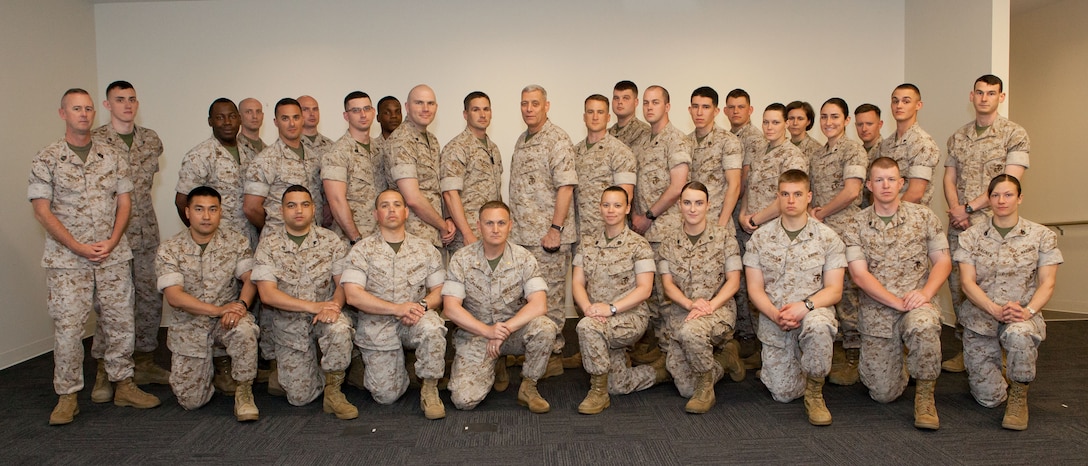 The Assistant Commandant of the Marine Corps, Gen. John M. Paxton, Jr., center right, poses for a photo with Marines while on a visit with Marine Forces Cyber Command in Columbia, Md., May 15, 2014. (U.S. Marine Corps photo by Cpl. Tia Dufour/Released)