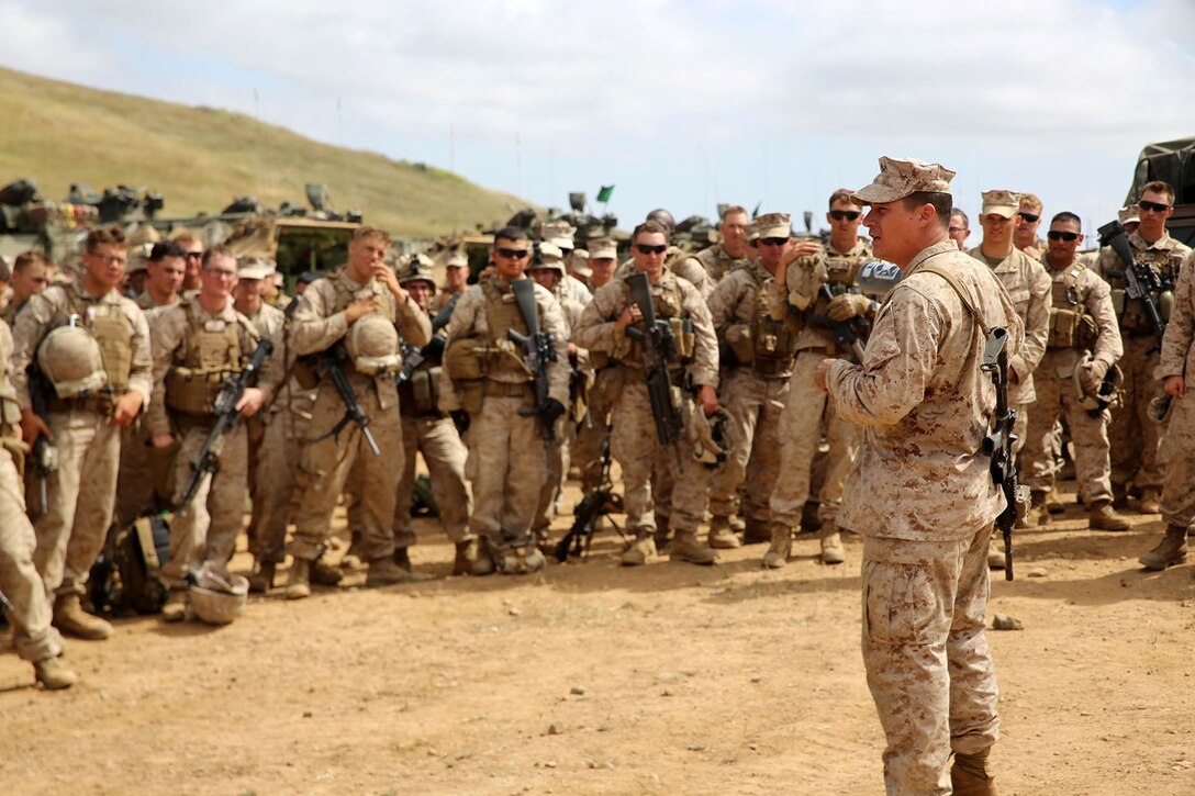 Marines with Echo Company, Battalion Landing Team 2nd Battalion, 1st Marines (BLT 2/1), 11th Marine Expeditionary Unit, return to their amphibious assault vehicles after conducting a company-sized mechanized assault exercise as part of Composite Training Unit Exercise (COMPTUEX) aboard Camp Pendleton, Calif., May 10. COMPTUEX is the second at-sea event in the 11th MEU and Makin Island Amphibious Ready Group joint predeployment training program, during which they will refine mission-related operations and blue-green communication. (U.S. Marine Corps photo by Sgt. Melissa Wenger/Released)