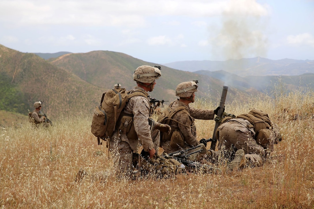 Marines with the mortars section of Echo Company, Battalion Landing Team 2nd Battalion, 1st Marines (BLT 2/1), 11th Marine Expeditionary Unit, employ the M224A1 60mm mortar system during a company-sized mechanized assault training exercise as part of Composite Training Unit Exercise (COMPTUEX) aboard Camp Pendleton, Calif., May 10. COMPTUEX provides the 11th MEU, along with the Makin Island Amphibious Ready Group, the opportunity to conduct command and control of amphibious operations from the sea. (U.S. Marine Corps photo by Sgt. Melissa Wenger/Released)