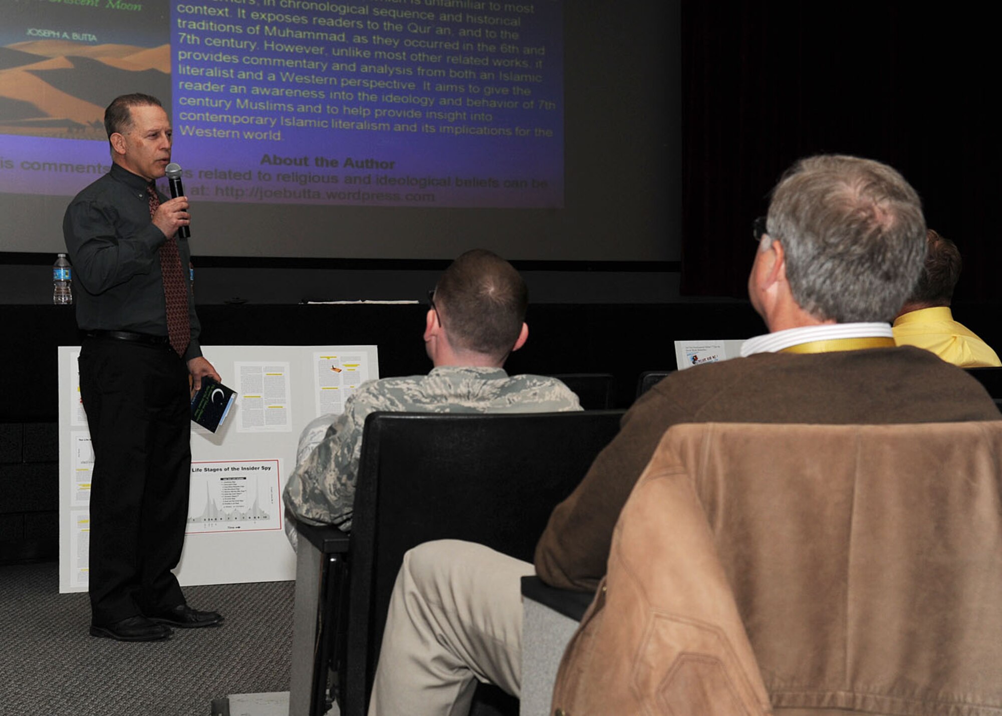 Joseph Butta, an author, speaks with Team Fairchild during the Operations Securty and Islamic Literalism presentations at Fairchild Air Force Base, Wash., May 19, 2014. Butta provided analysis from both an Islamic literalist and a Western perspective. (U.S. Air Force photo by Airman 1st Class Janelle Patiño/Released)