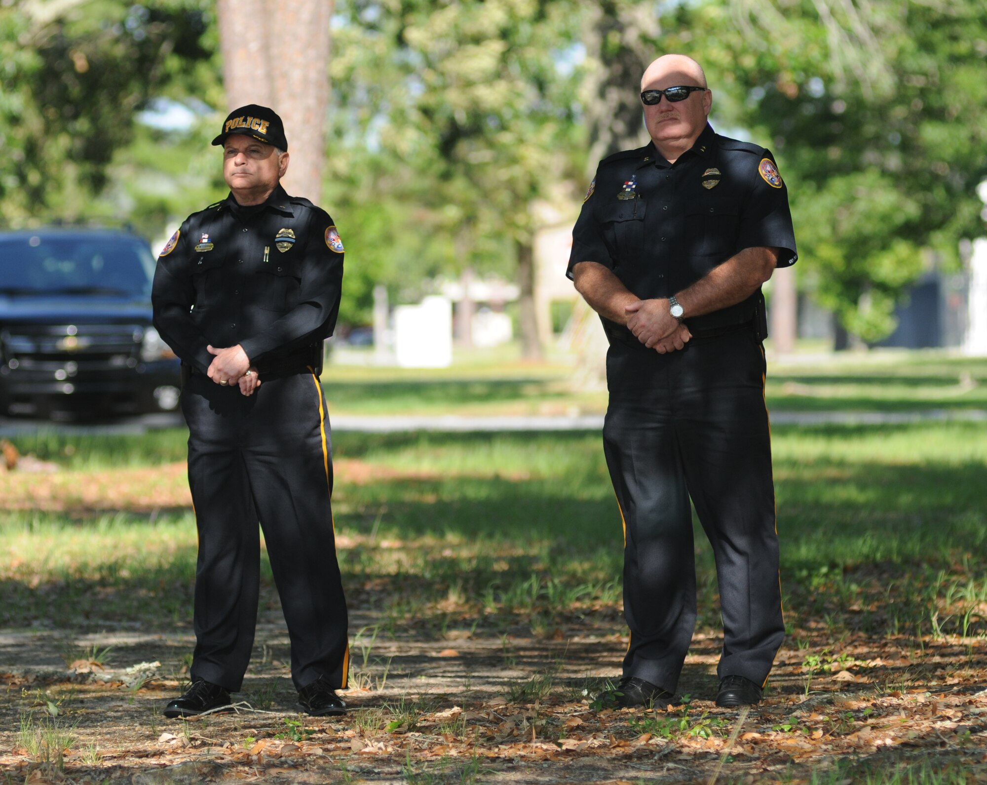 Rodney McGilvary, Biloxi Police Department assistant chief, and John Miller, Biloxi Police Department chief, attend a retreat ceremony hosted by the 81st Security Forces Squadron May 15, 2014, at Keesler Air Force Base, Miss.  The retreat ceremony was held in memory of all law enforcement officers in the State of Mississippi, Air Force Officers of Special Investigations and 81st SFS members who have lost their lives in the line of duty over the past year.  (U.S. Air Force photo by Kemberly Groue)
