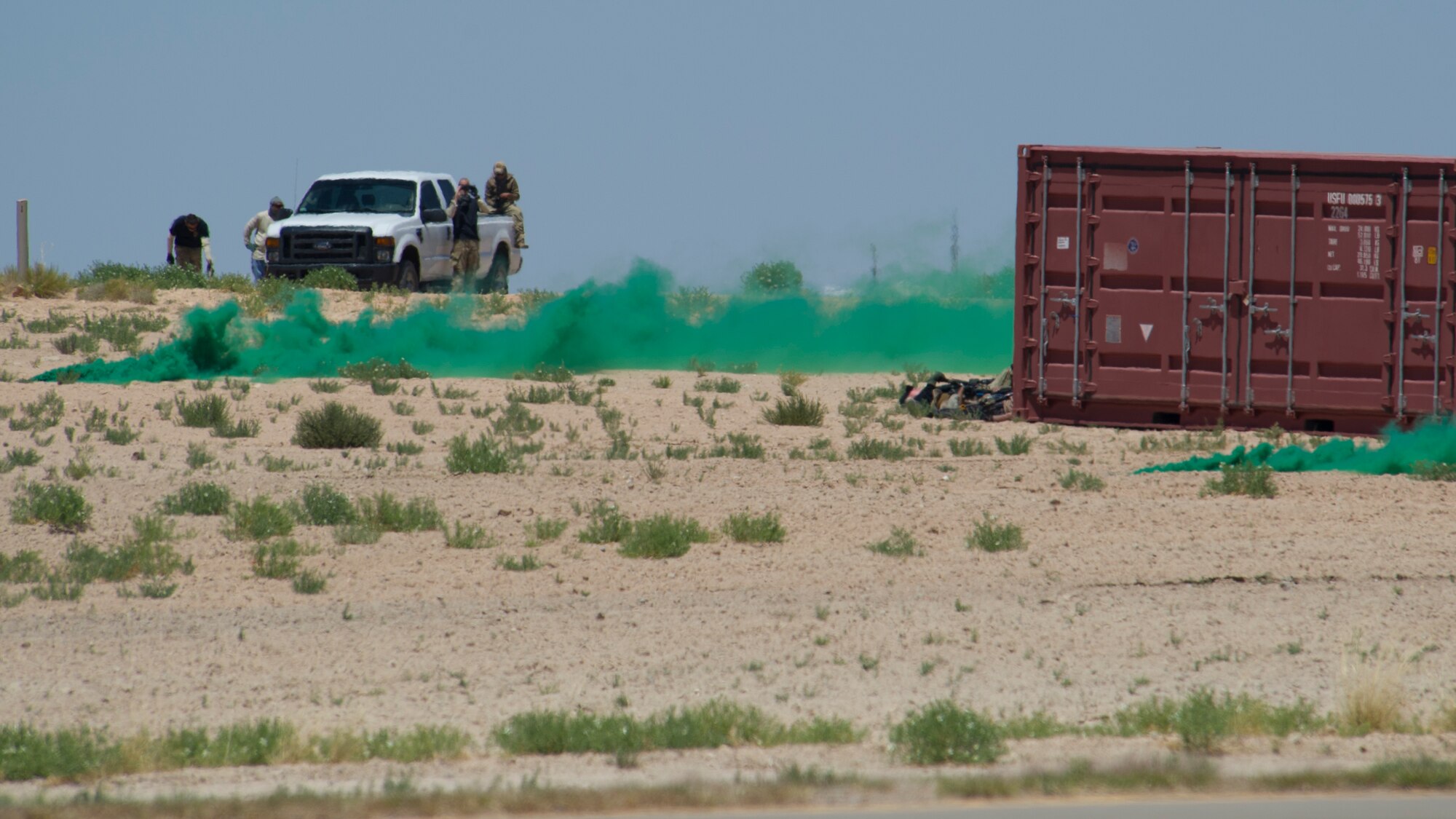 U.S. Air Force Tactical Air Control Party Specialists demonstrate the close air support capabilities of the F-16 Fighting Falcon during a simulated confrontation at the Holloman Air Force Base, N.M., Open House event May 10. Team Holloman hosted an Open House showcasing over 50 aircraft and the day-to-day duties of Holloman Airmen. With live flying demonstrations and static displays, thousands of guests attended the event to get a close-up look at the base’s assets and capabilities. Guests were able to view various aircraft, visit numerous vendors, and witness ground demonstrations from squadrons around the base. (U.S. Air Force photo by Airman 1st Class Aaron Montoya / Released)