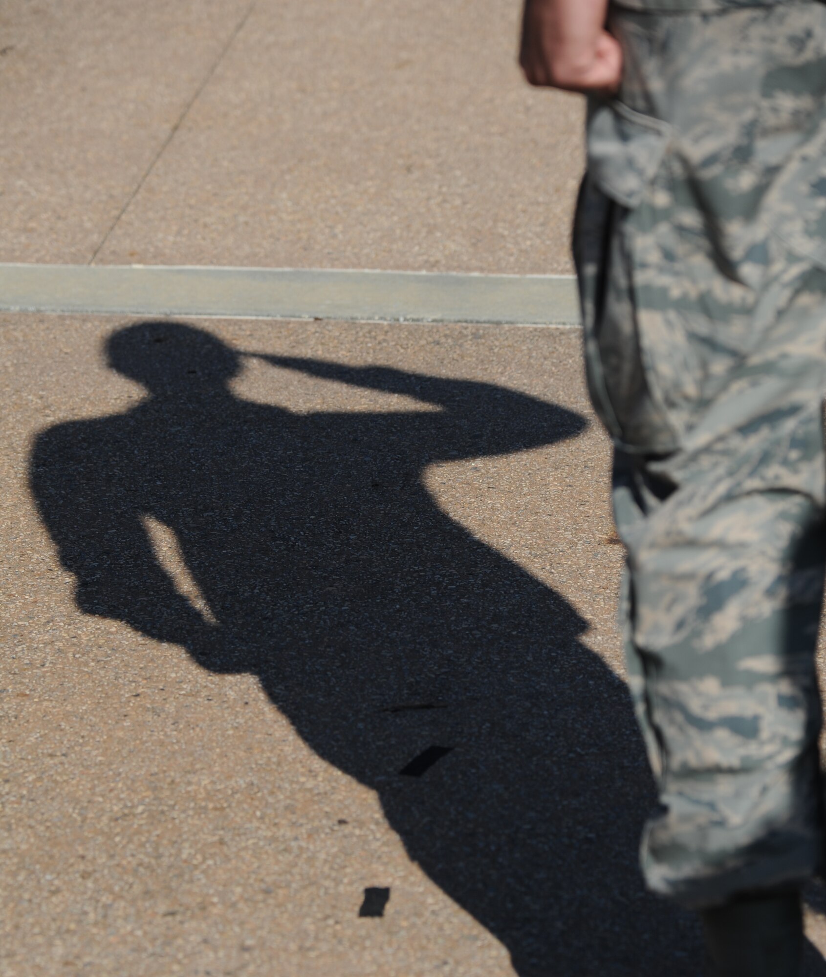 A members of the 81st Security Forces Squadron renders a salute during a retreat ceremony hosted by the 81st SFS May 15, 2014, at Keesler Air Force Base, Miss.  The retreat ceremony was held in memory of all law enforcement officers in the State of Mississippi, Air Force Officers of Special Investigations and 81st SFS members who have lost their lives in the line of duty over the past year.  (U.S. Air Force photo by Kemberly Groue)