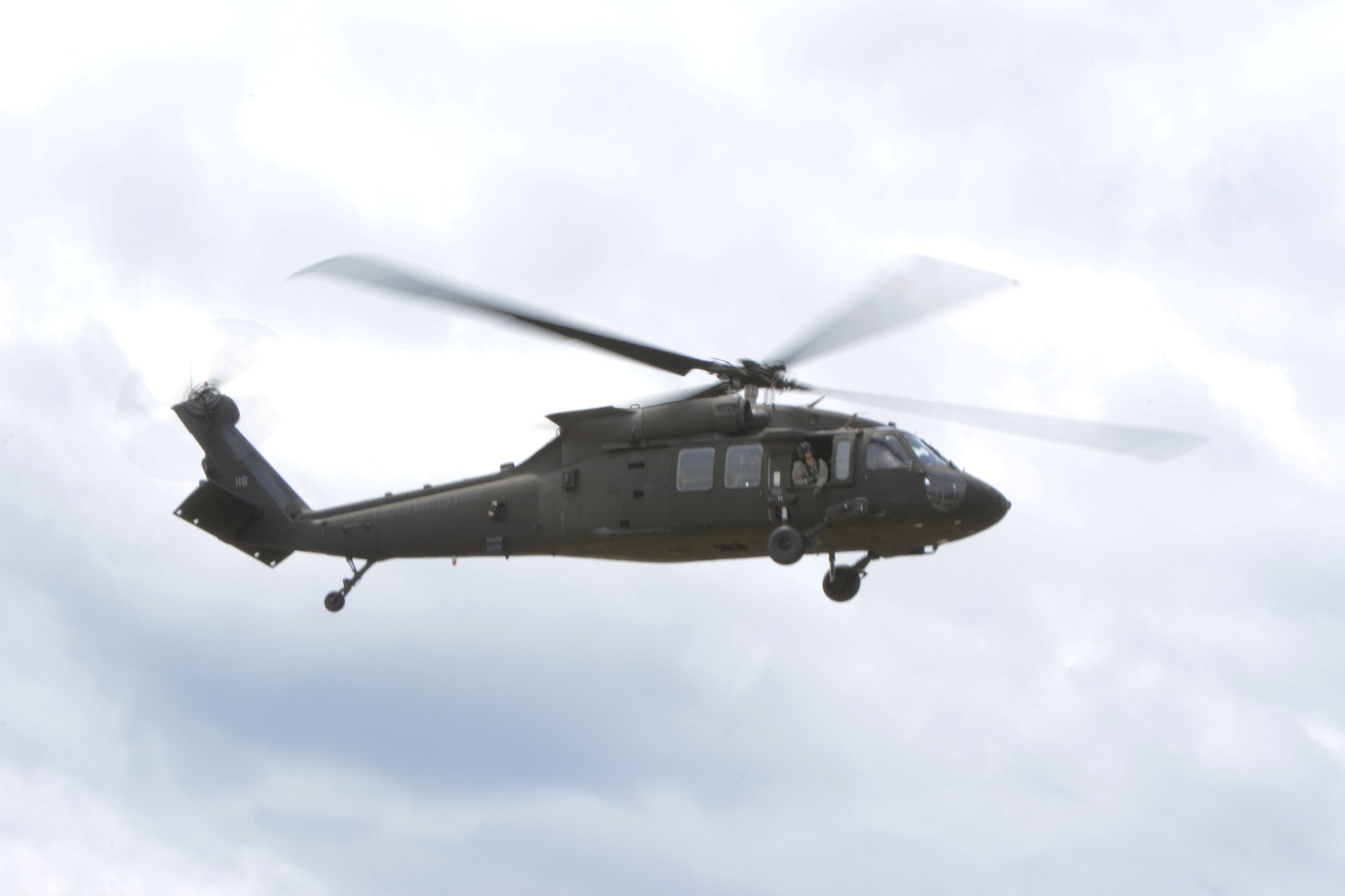 A UH-60 Black Hawk circles above the Sunnyview Exposition Center during the 2014 State Interoperable Mobile Communications Exercise in Oshkosh, Wis., May 15, 2014. The UH-60 Black Hawk was used to test air-to-ground communications. (Air National Guard photo by Senior Airman Andrea F. Liechti)
