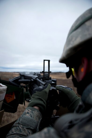 A U.S. Air Force Airman from the 133rd Security Forces Squadron fires off a round on the MK19-3 40 mm grenade machine gun on Camp Ripley, Minn., Apr. 13, 2014. Once qualified, the 133rd Security Forces Squadron will be part of the Heavy Weapons Team for future deployments in support of the war on terrorism. (U.S. Air National Guard photo by Staff Sgt. Austen Adriaens/Released)