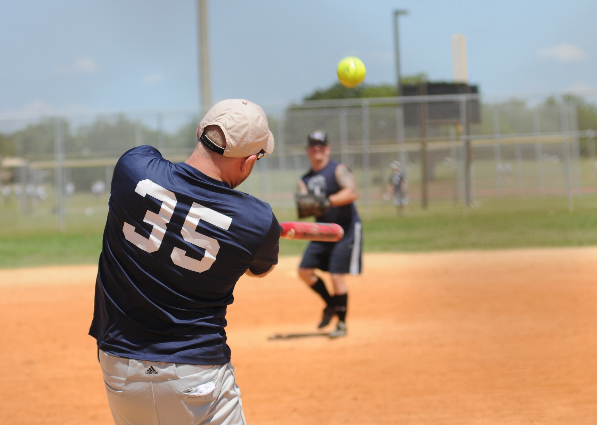 First Lt. Joseph Giametta, 85th Engineering Installation Squadron, takes a swing during a home run derby hosted by the 81st Security Forces Squadron May 16, 2014, at Keesler Air Force Base, Miss.  The softball tournament was held in celebration of National Police Week, which recognizes the service of men and women who put their lives at risk every day.  (U.S. Air Force photo by Kemberly Groue)