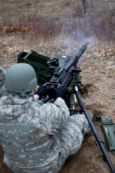 A U.S. Air Force Airman from the 133rd Security Forces Squadron fires off a round on the MK19-3 40 mm grenade machine gun on Camp Ripley, Minn., Apr. 13, 2014. Once qualified, the 133rd Security Forces Squadron will be part of the Heavy Weapons Team for future deployments in support of the war on terrorism. (U.S. Air National Guard photo by Staff Sgt. Austen Adriaens/Released)
