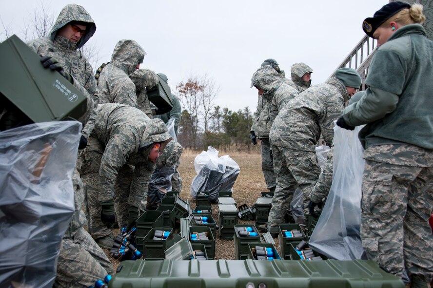 U.S. Air Force Airmen from the 133rd Security Forces Squadron train and qualify on the MK19-3 40 mm grenade machine gun on Camp Ripley, Minn., Apr. 13, 2014. Once qualified, these Airmen will be part of the Heavy Weapons Team for future deployments in support of the war on terrorism. (U.S. Air National Guard photo by Staff Sgt. Austen Adriaens/Released)